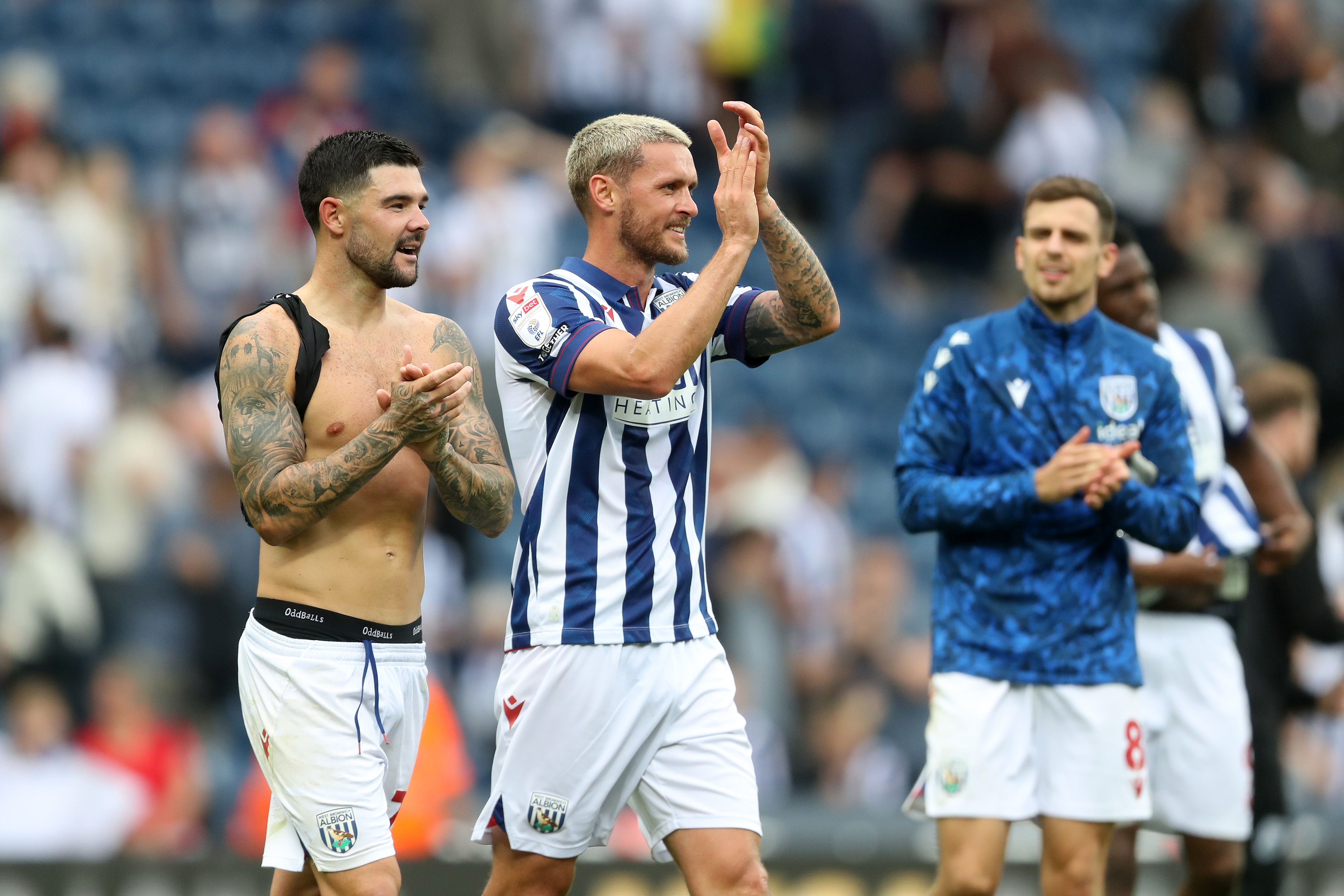 Alex Mowatt and John Swift applauding Albion fans after the game against Swansea 