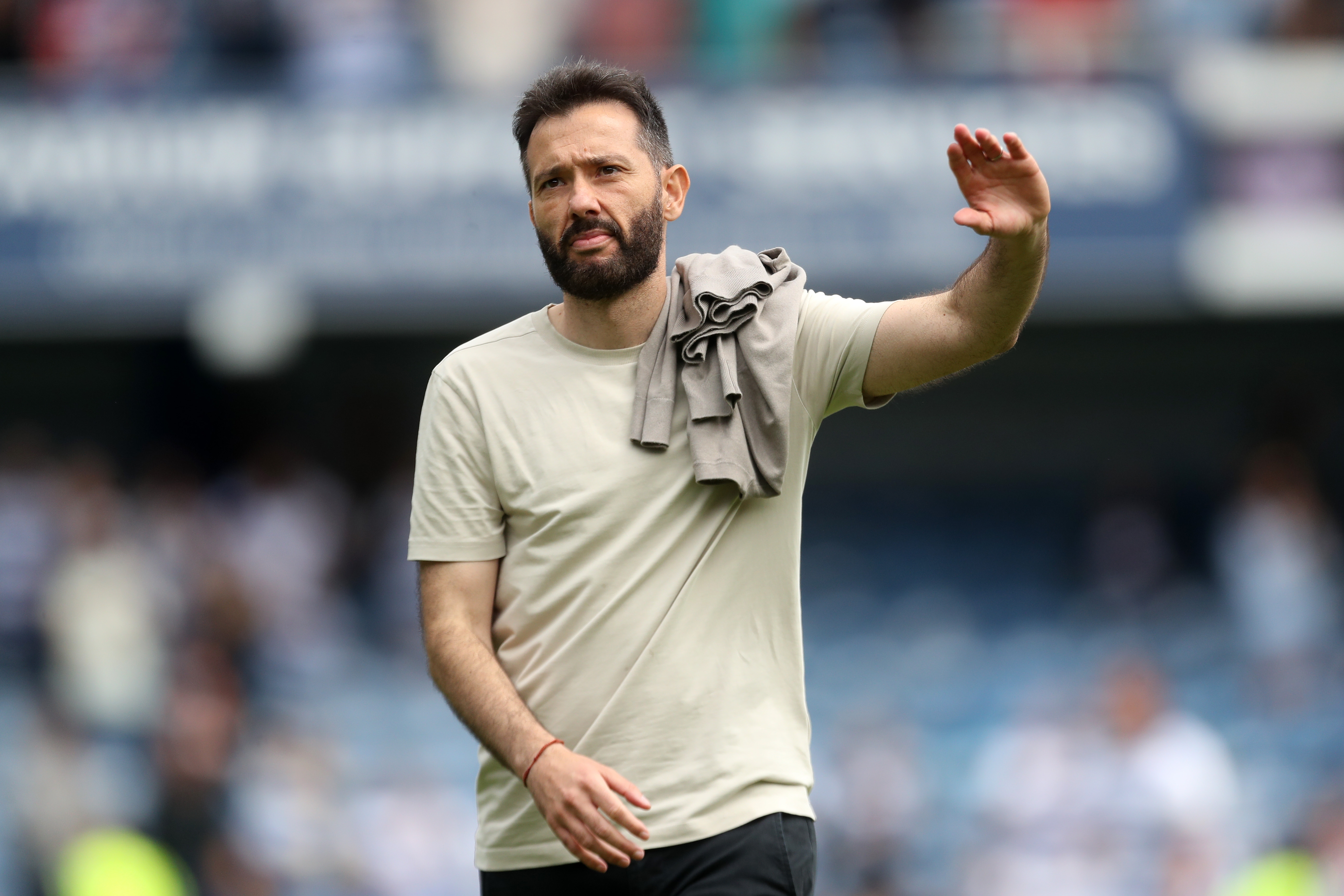 Carlos Corberán applauding Albion fans at QPR 