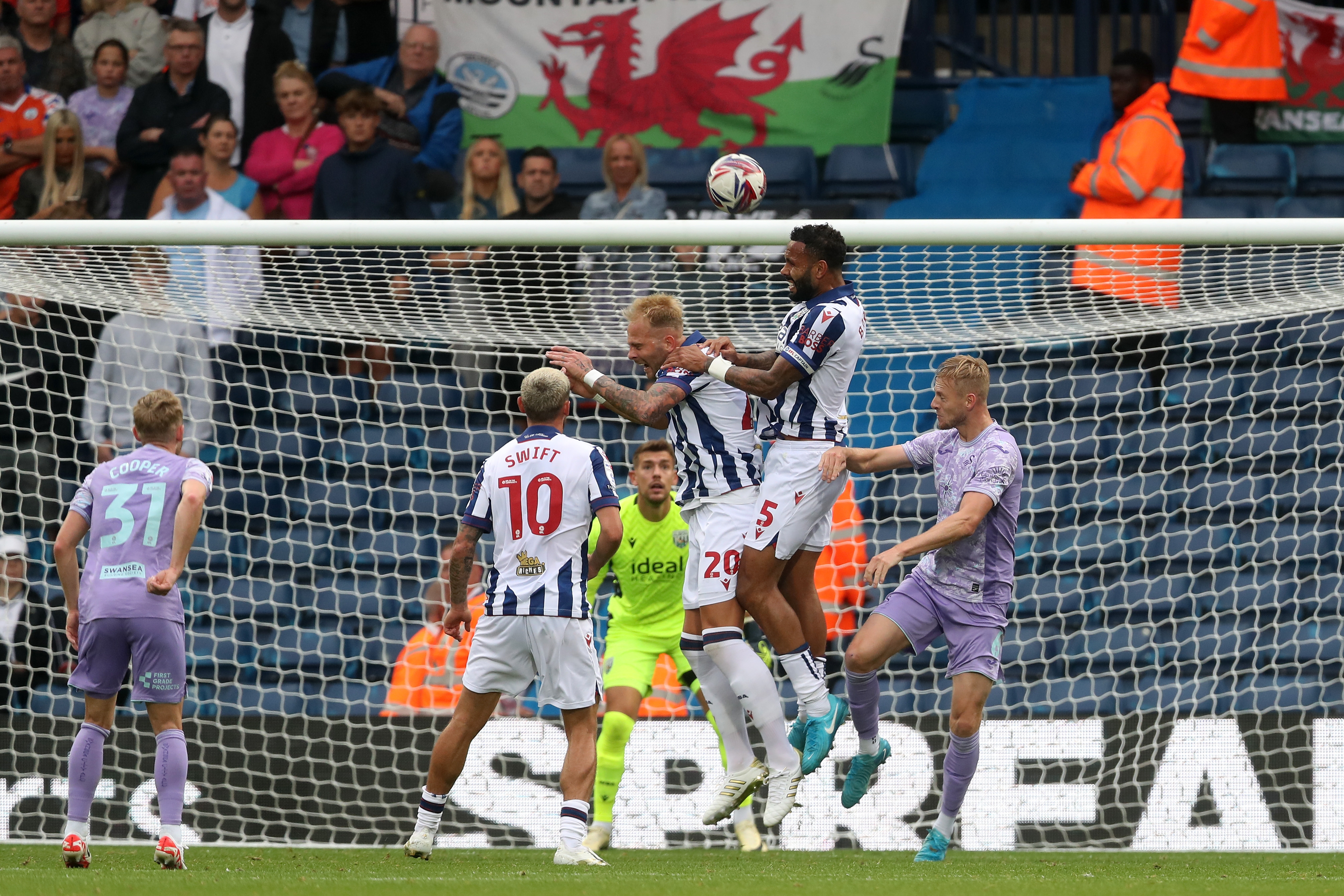 Kyle Bartley jumps to win a header against Swansea 