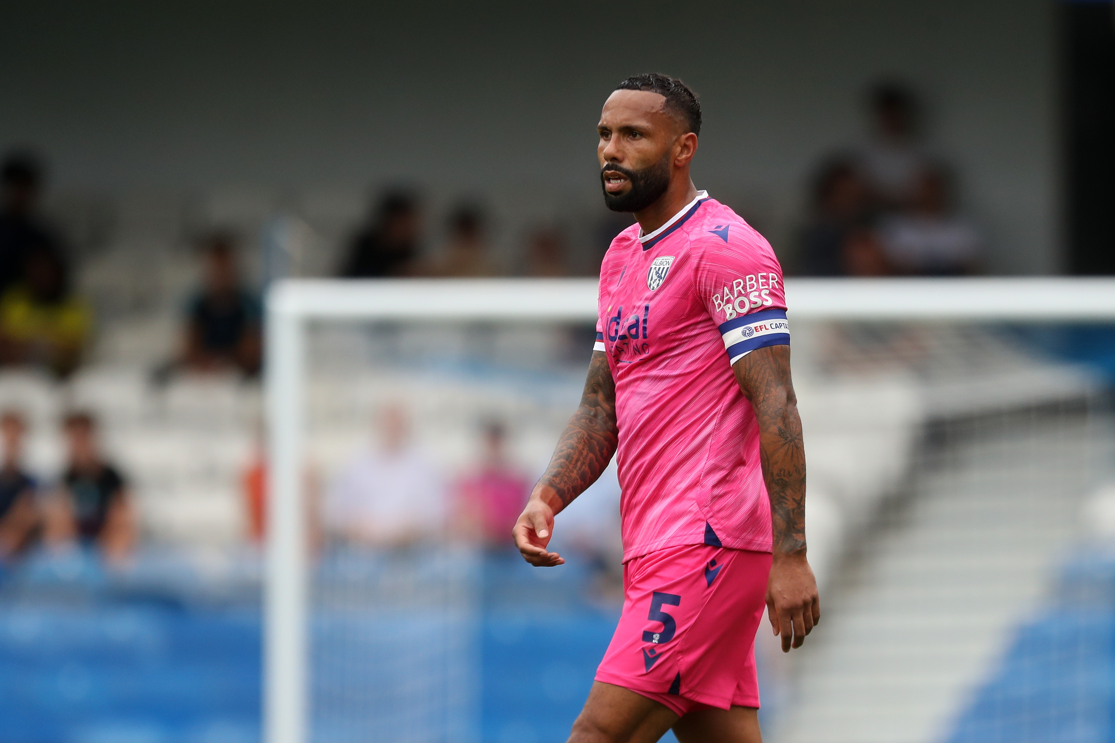 Kyle Bartley watching the game at QPR with the captain's armband on