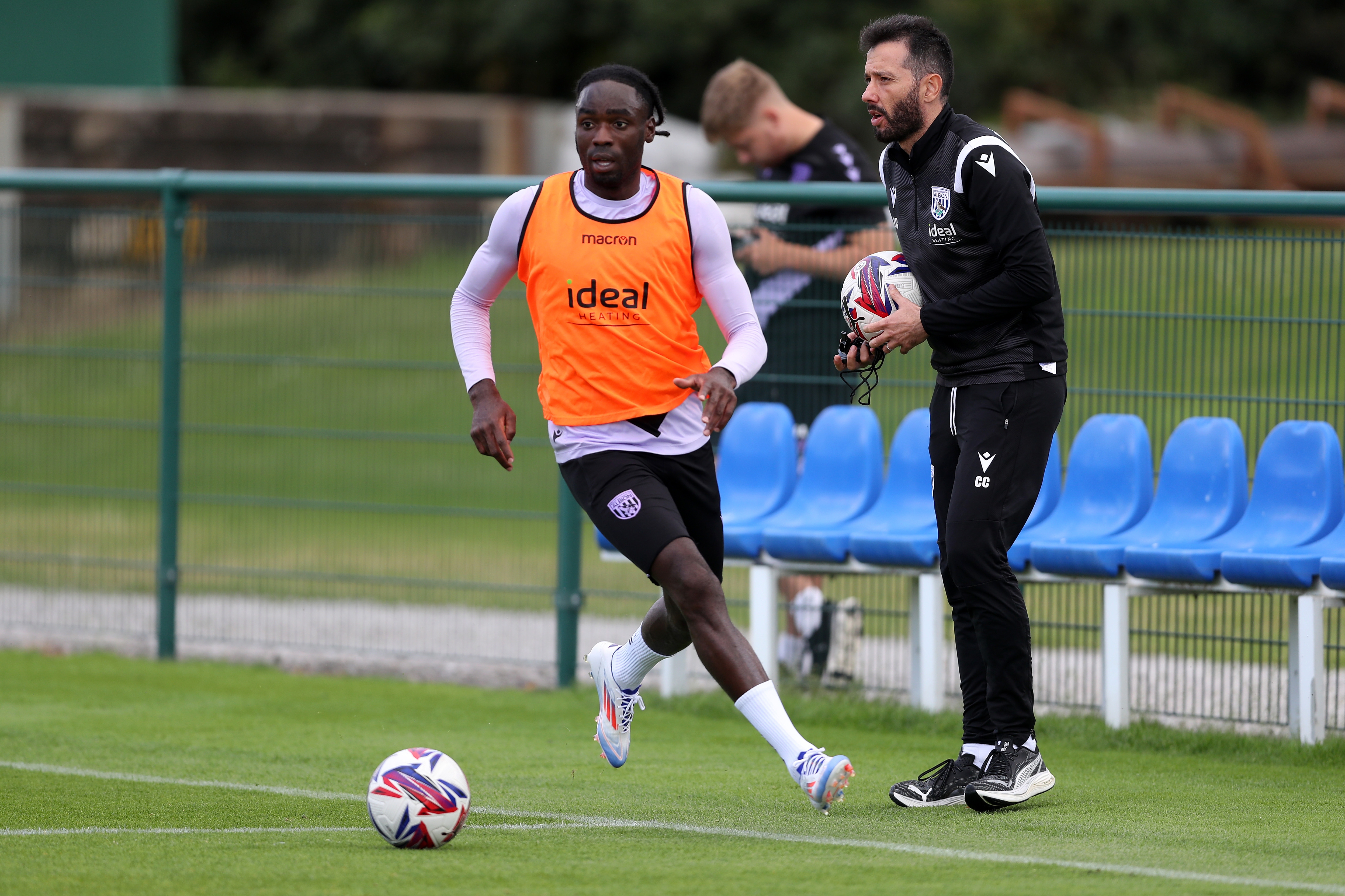 Devante Cole on the ball during training wearing a bib