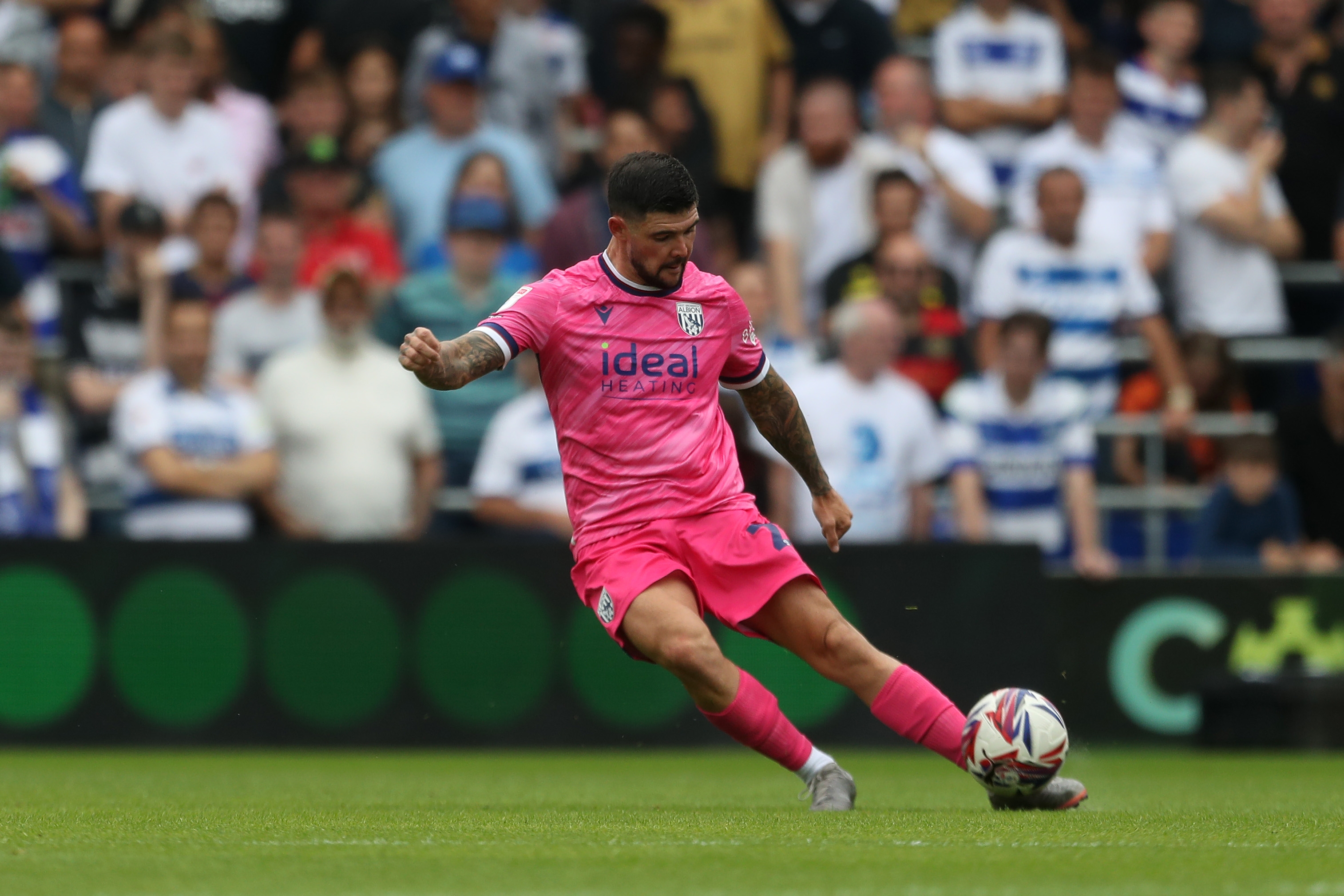 Alex Mowatt striking the ball at QPR 