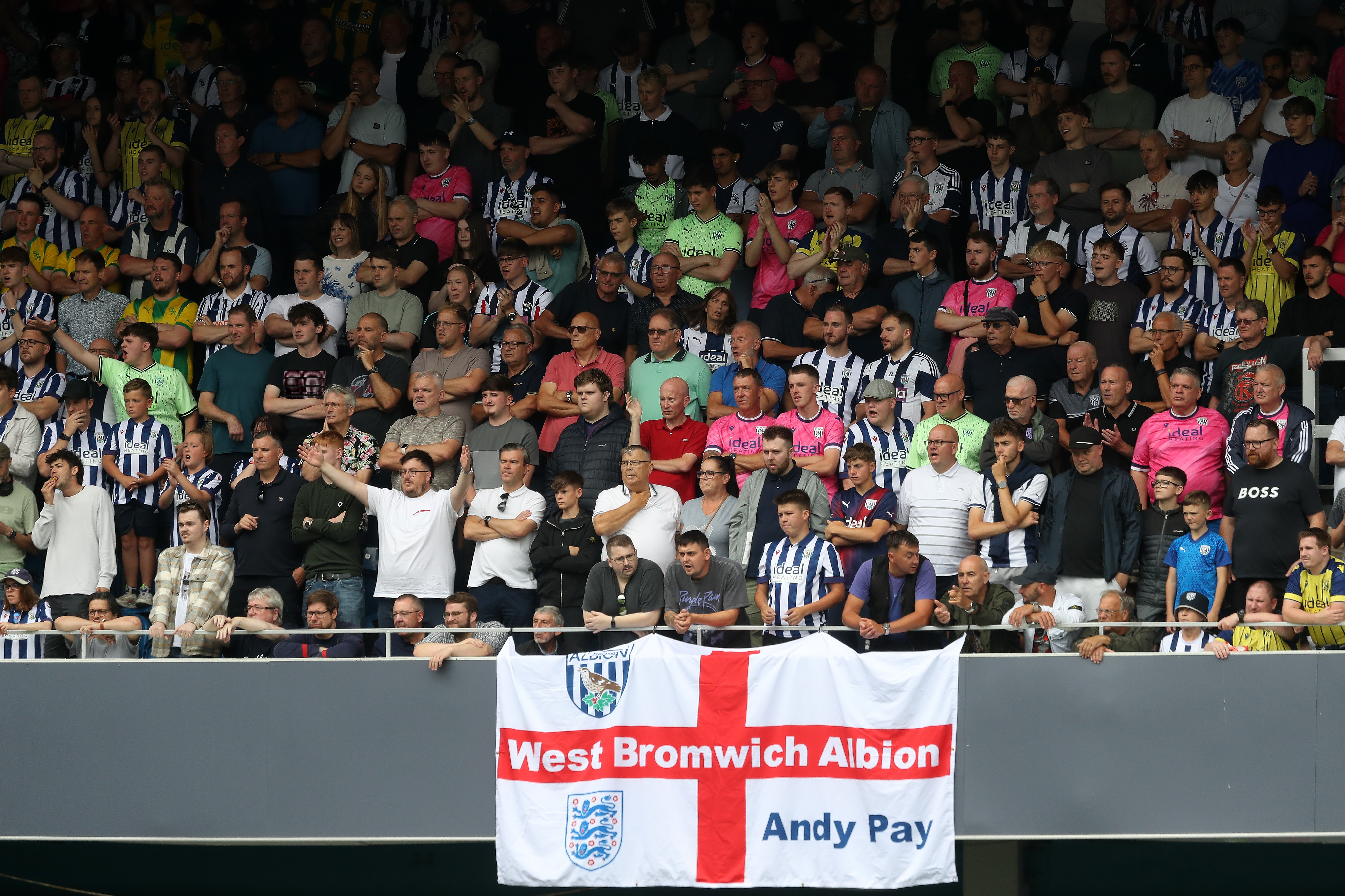 A general view of Albion fans at QPR with a big England flag 