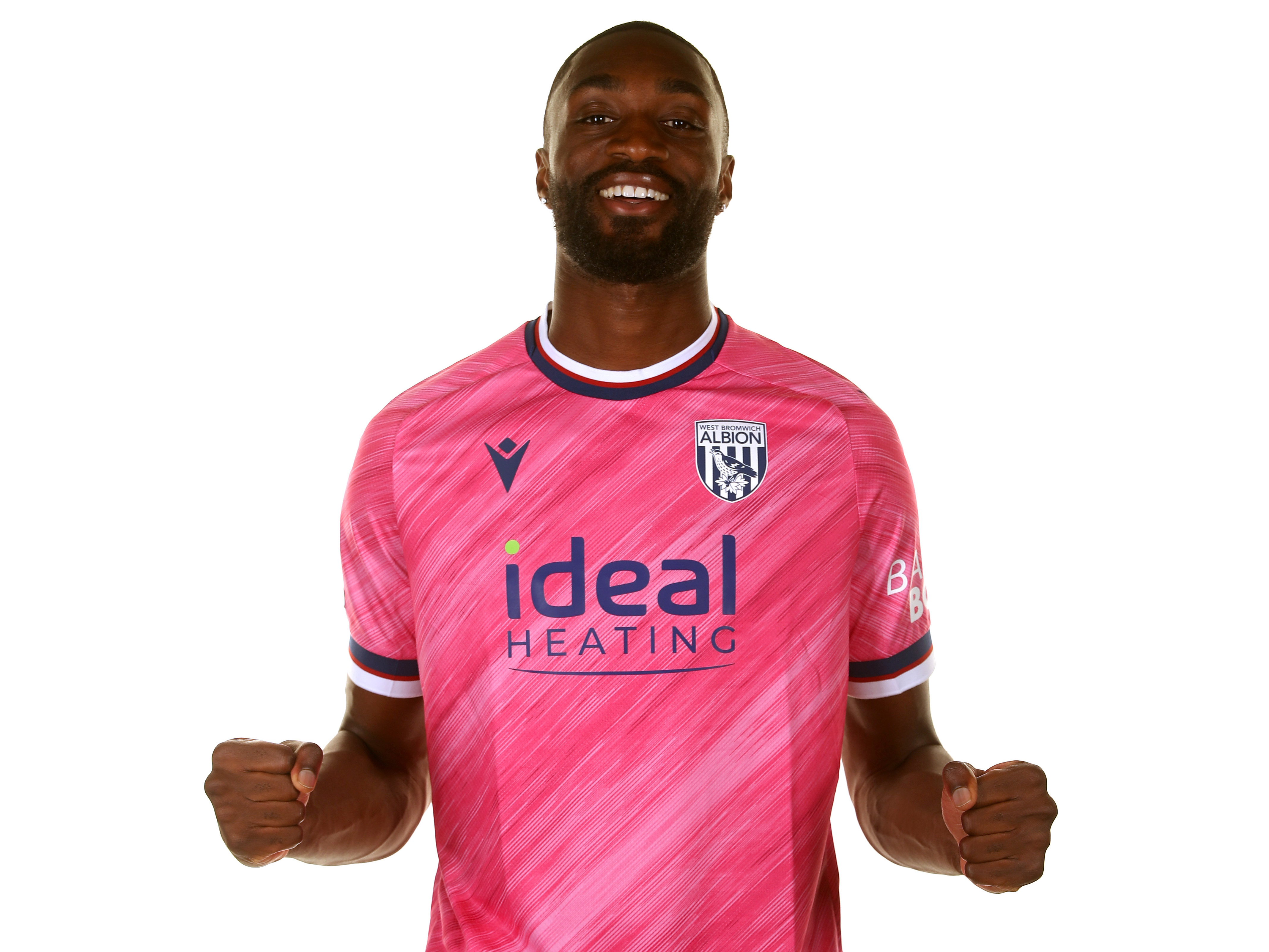 Semi Ajayi smiling at the camera in the pink away shirt 