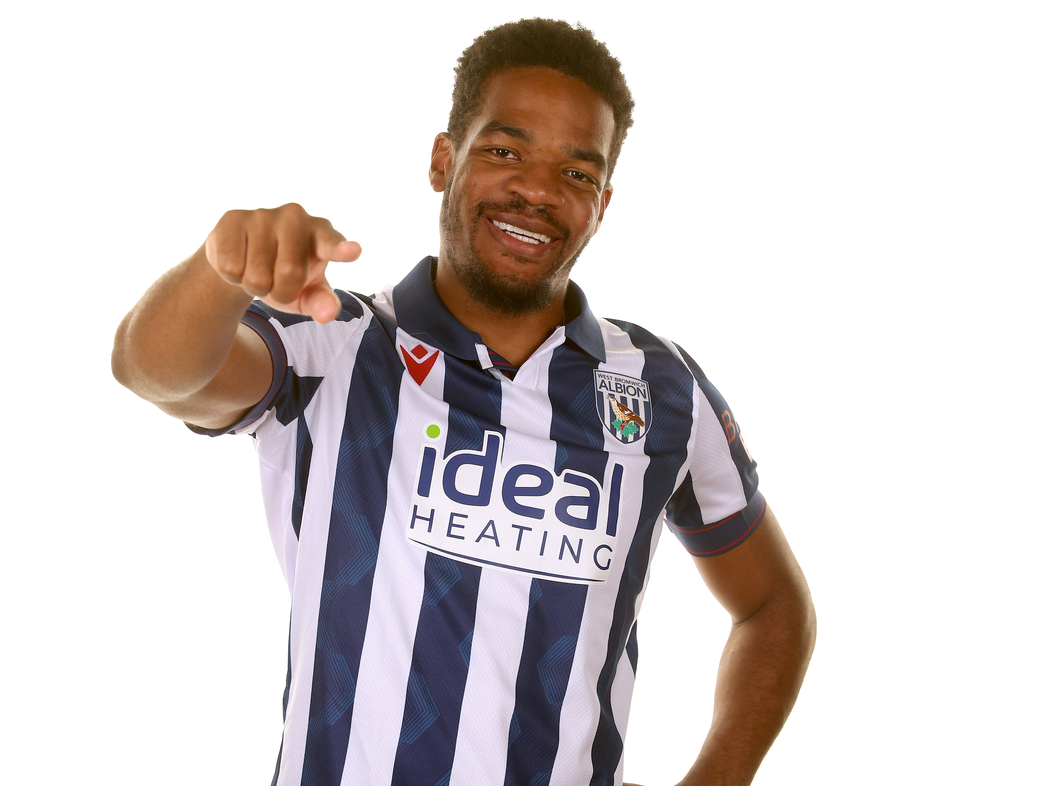 Grady Diangana smiling at camera and pointing at it while wearing a home shirt 