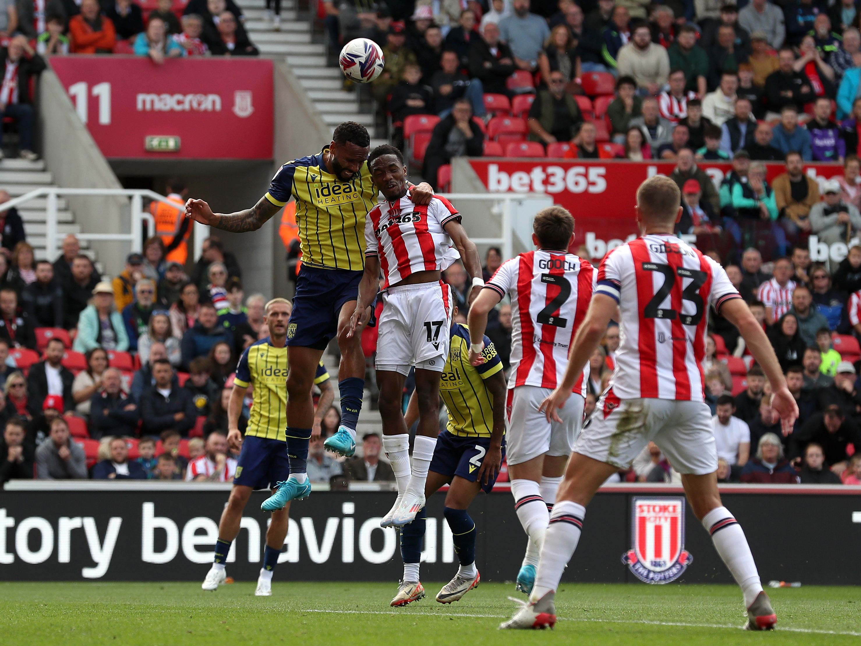 A photo of Albion players in the yellow and blue 2024/25 away kit against Stoke City