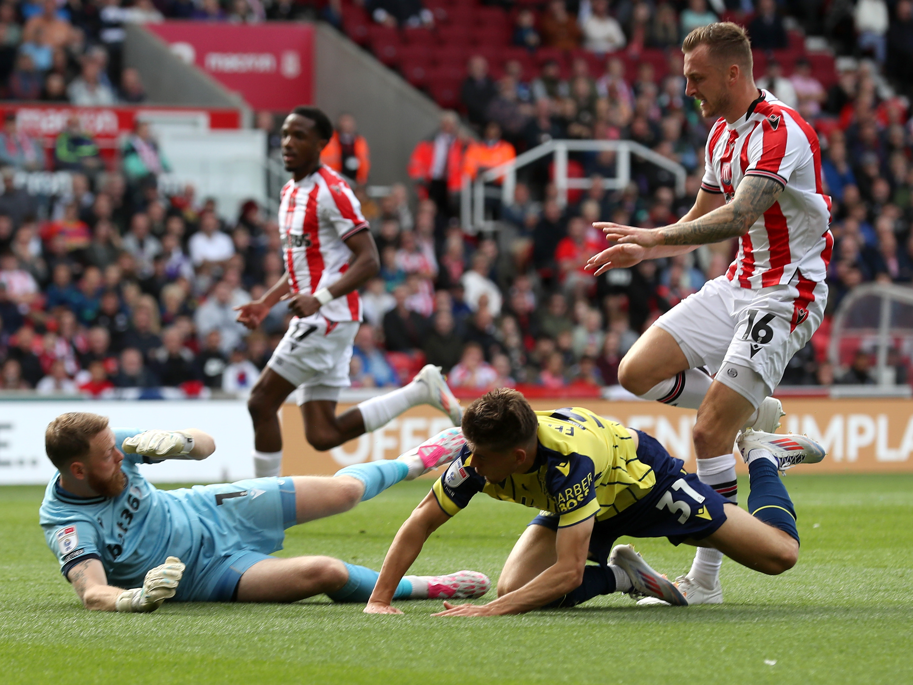 A photo of Albion players in the yellow and blue 2024/25 away kit against Stoke City