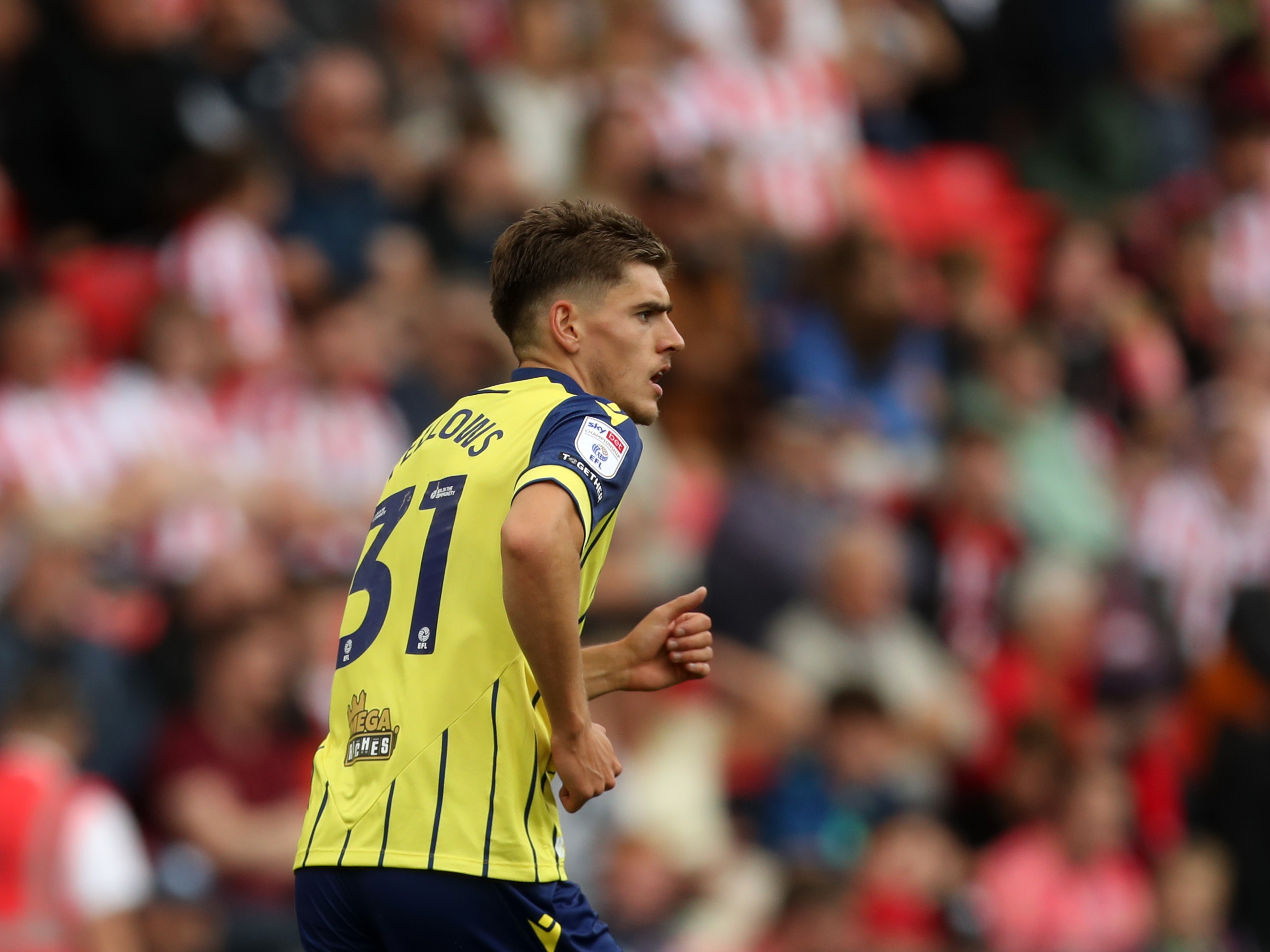 A photo of Albion players in the yellow and blue 2024/25 away kit against Stoke City