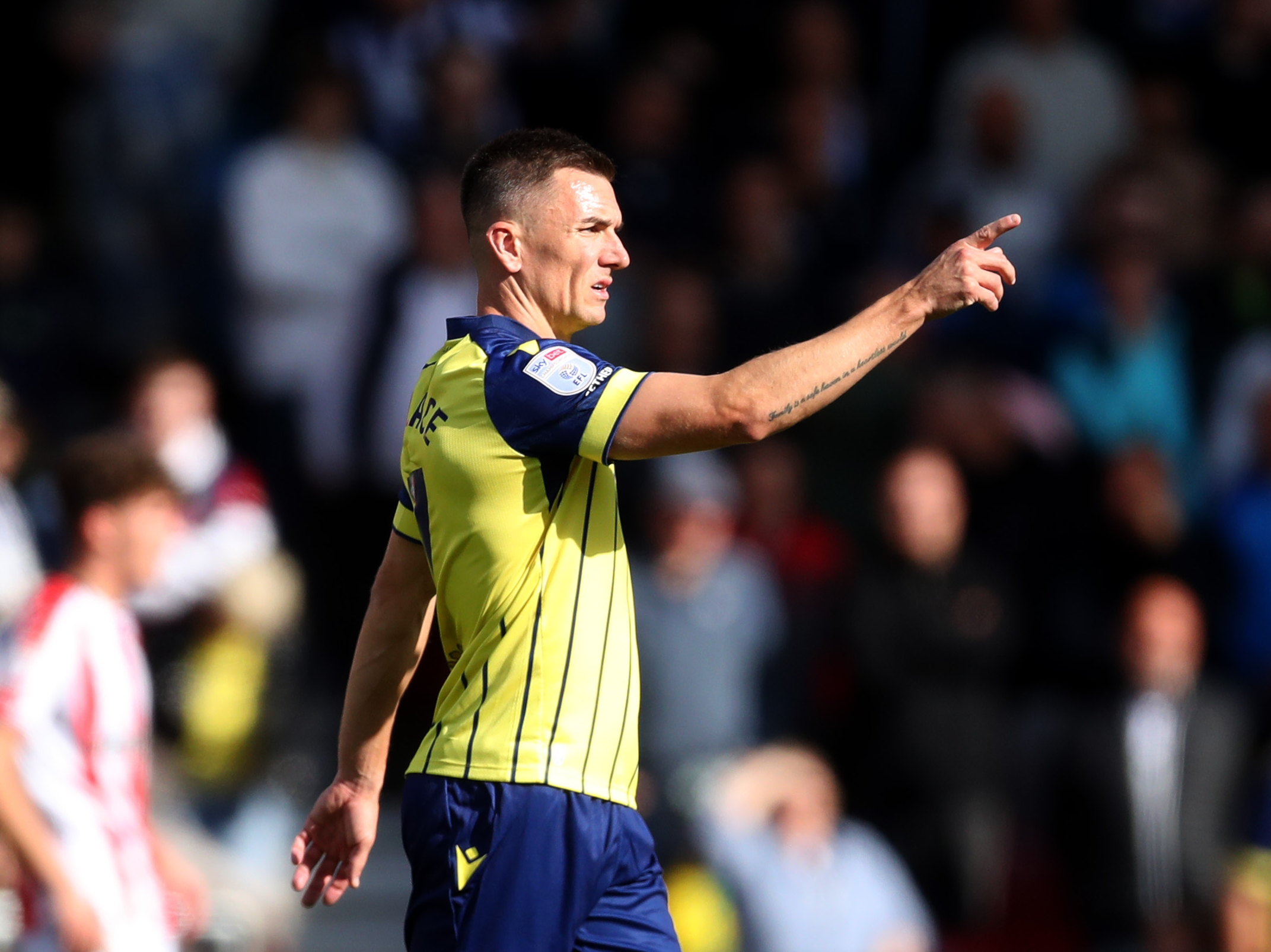 A photo of Albion players in the yellow and blue 2024/25 away kit against Stoke City