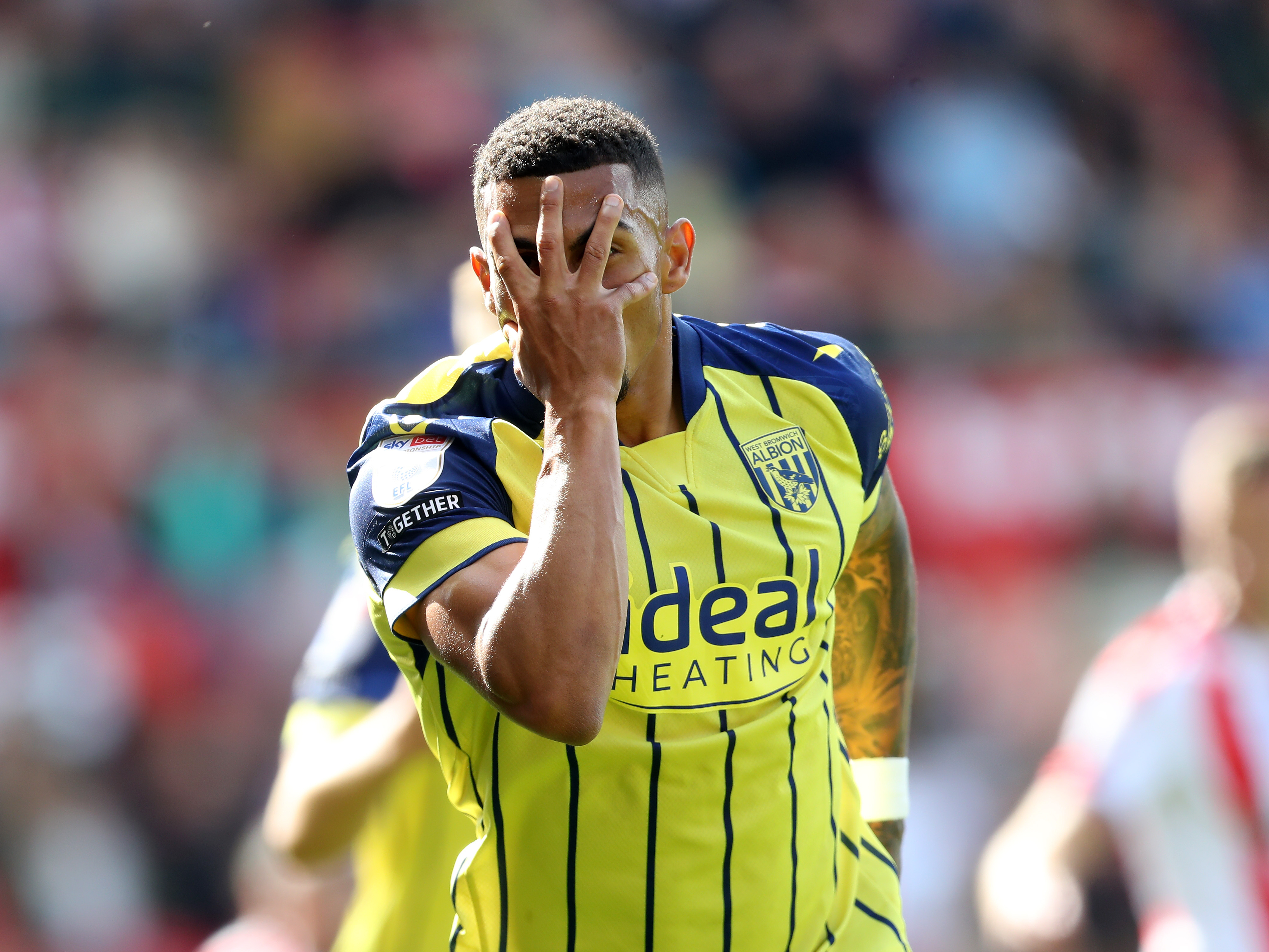 A photo of Albion players in the yellow and blue 2024/25 away kit against Stoke City