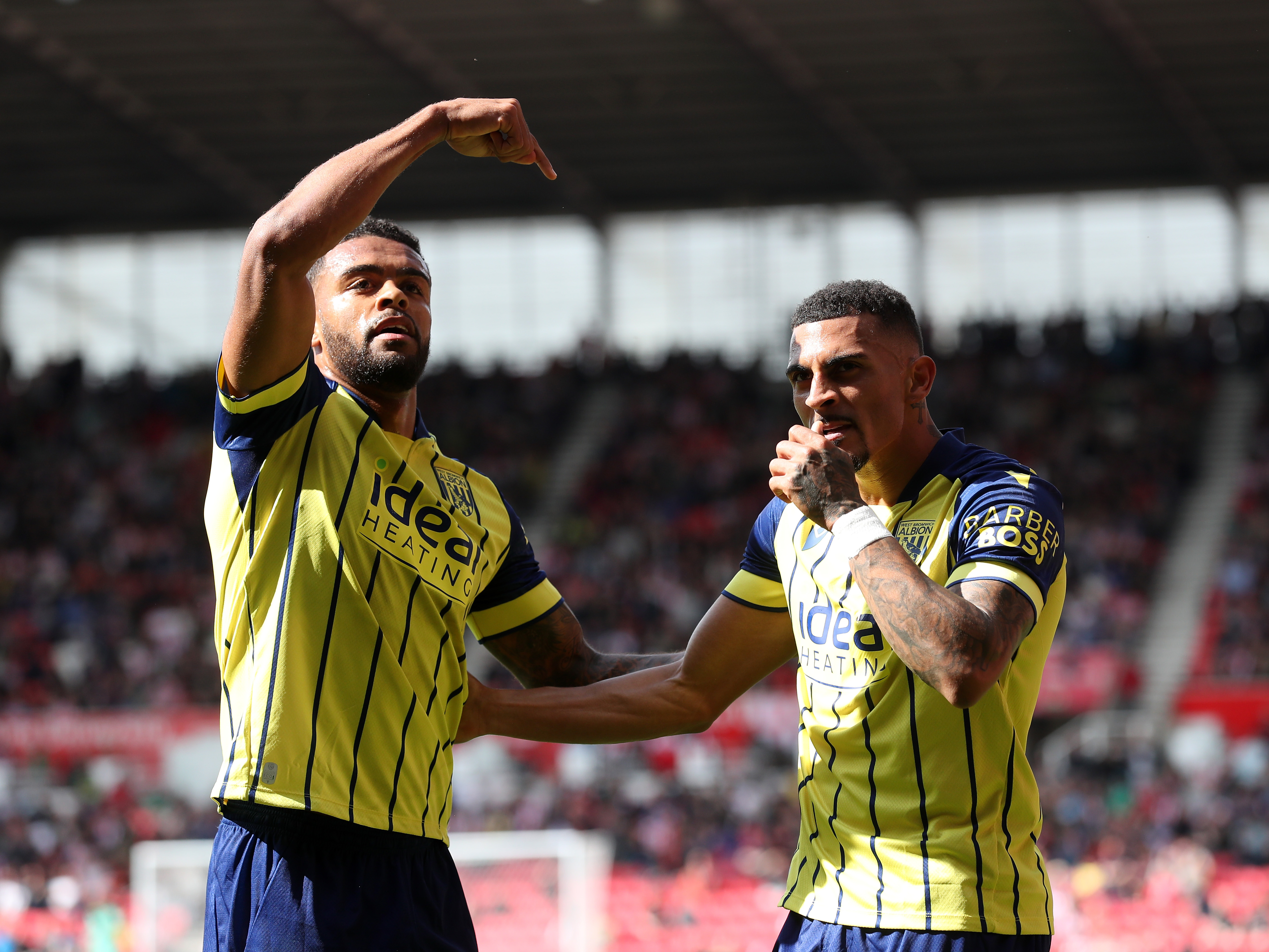 A photo of Albion players in the yellow and blue 2024/25 away kit against Stoke City