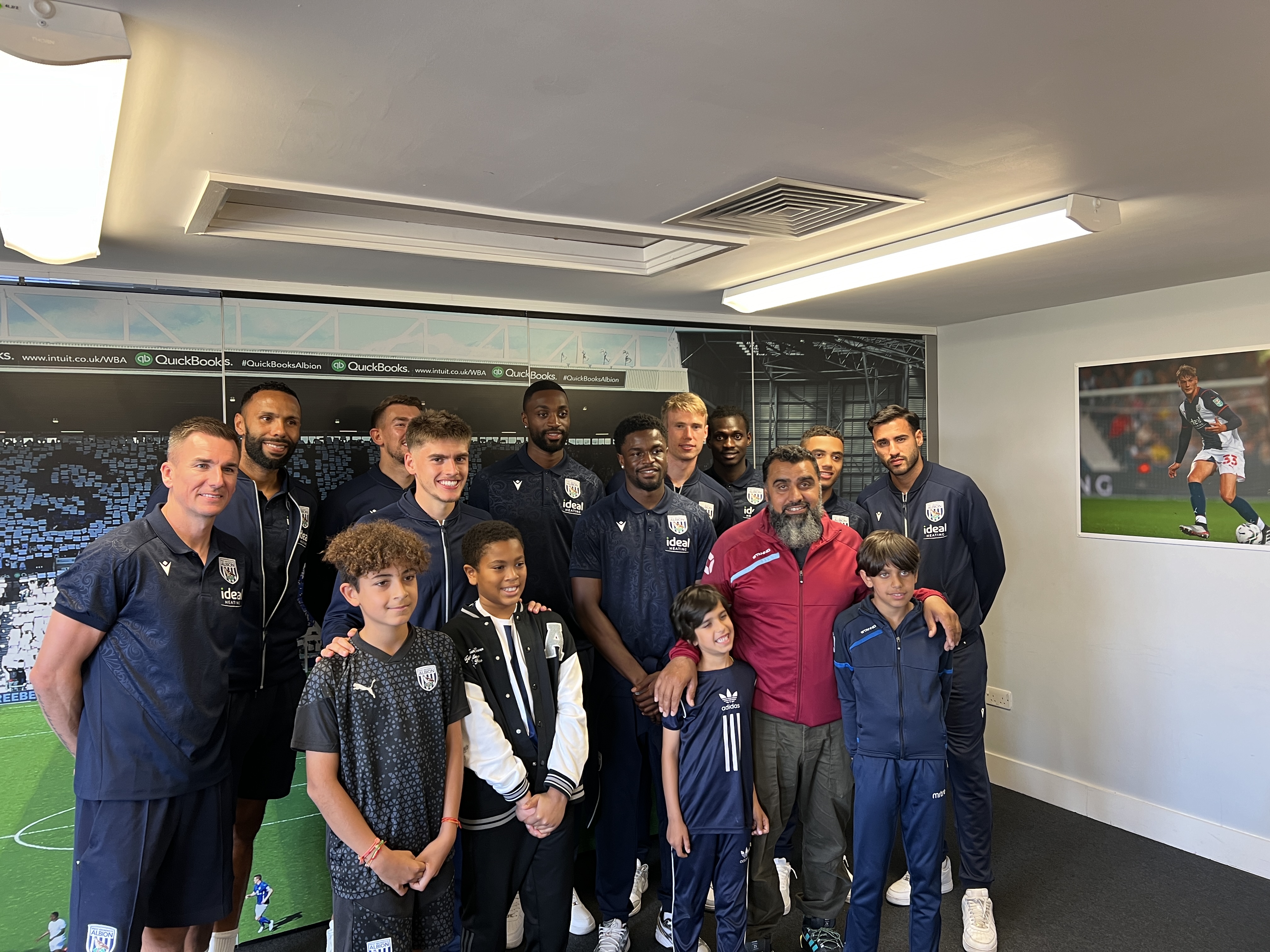 Go Local community participants pose with Albion first team players.