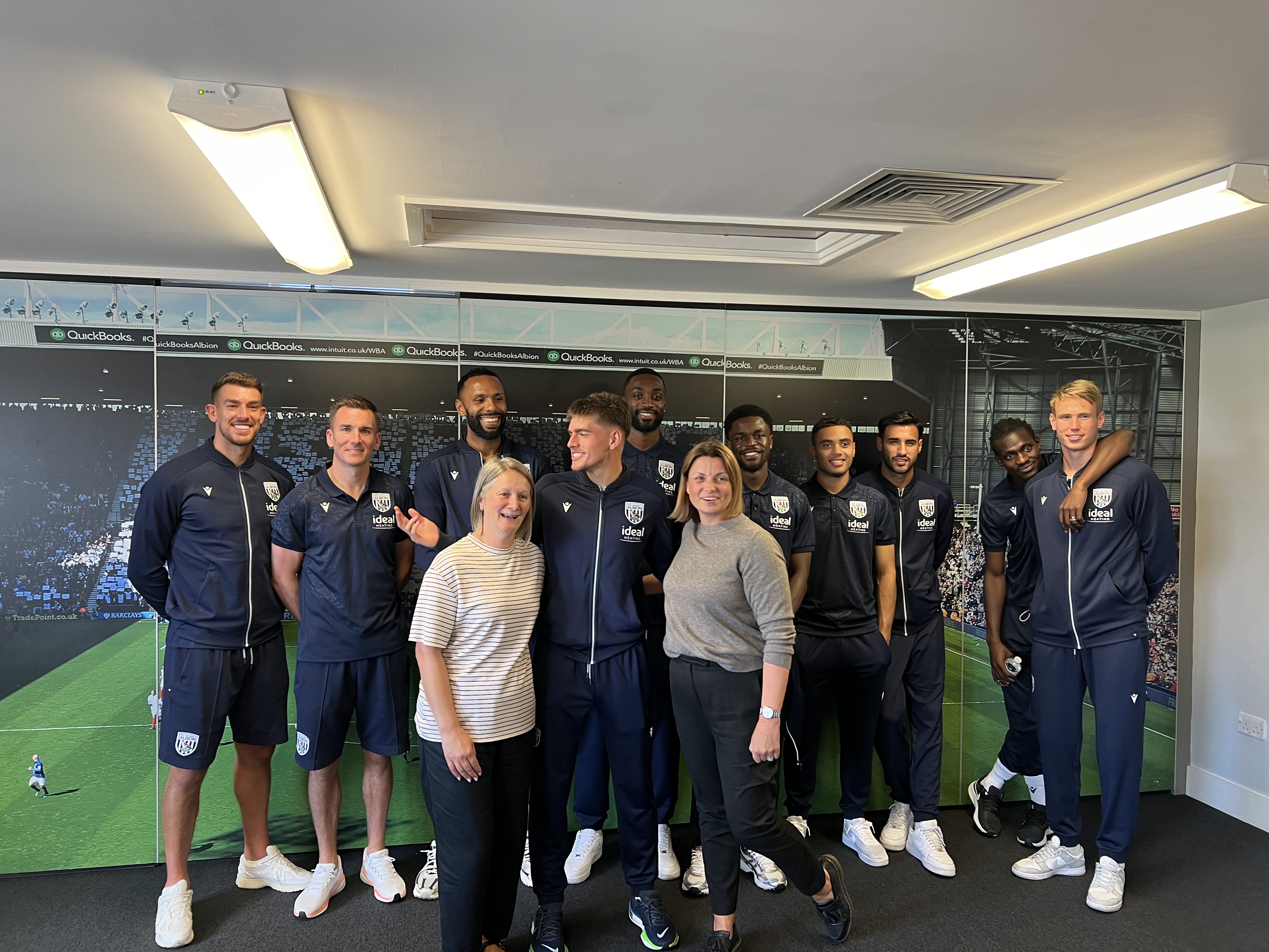 All Access Albion representatives pose with Albion first team players.