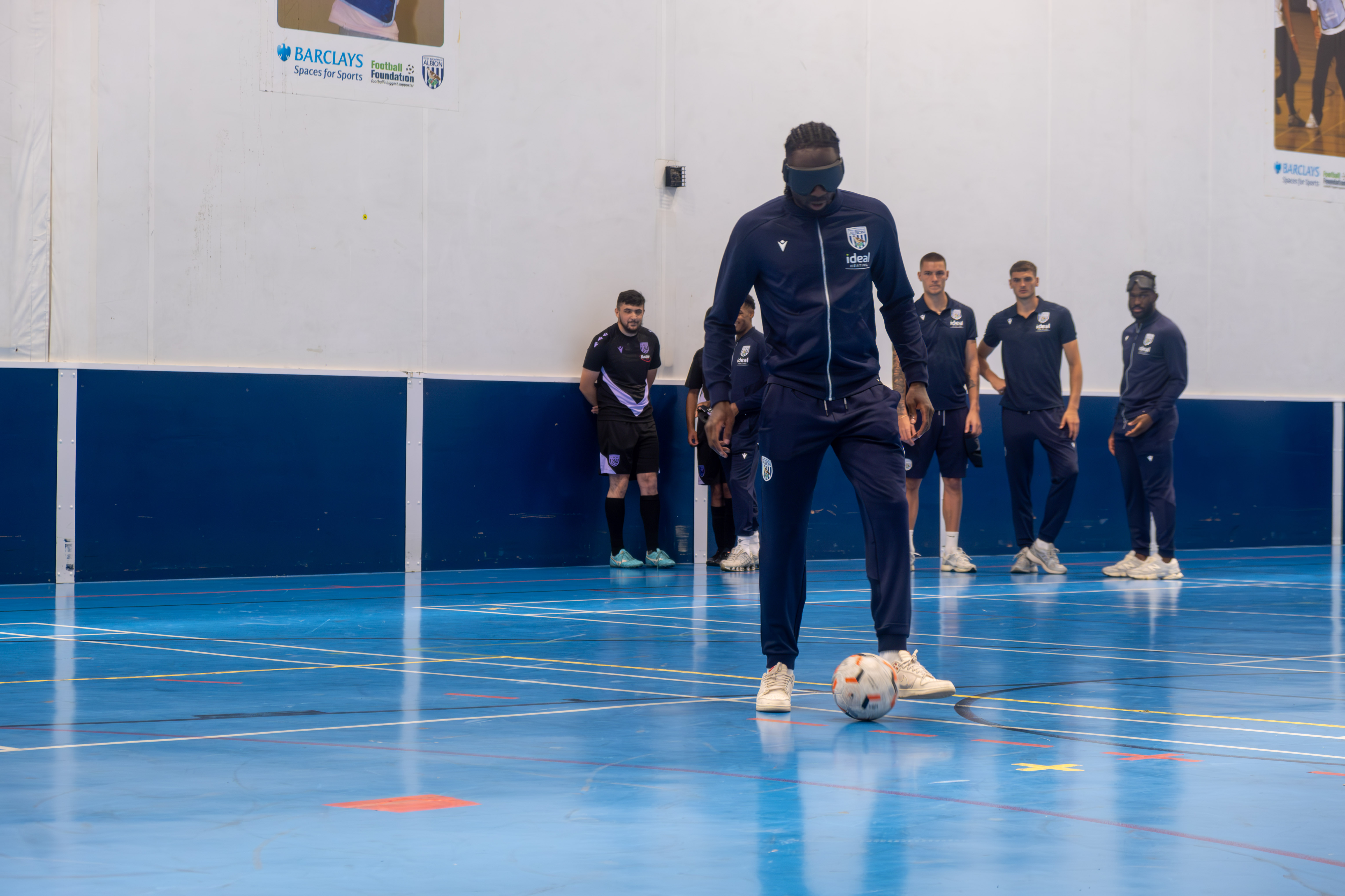 Devante Cole takes part in a blind football session.