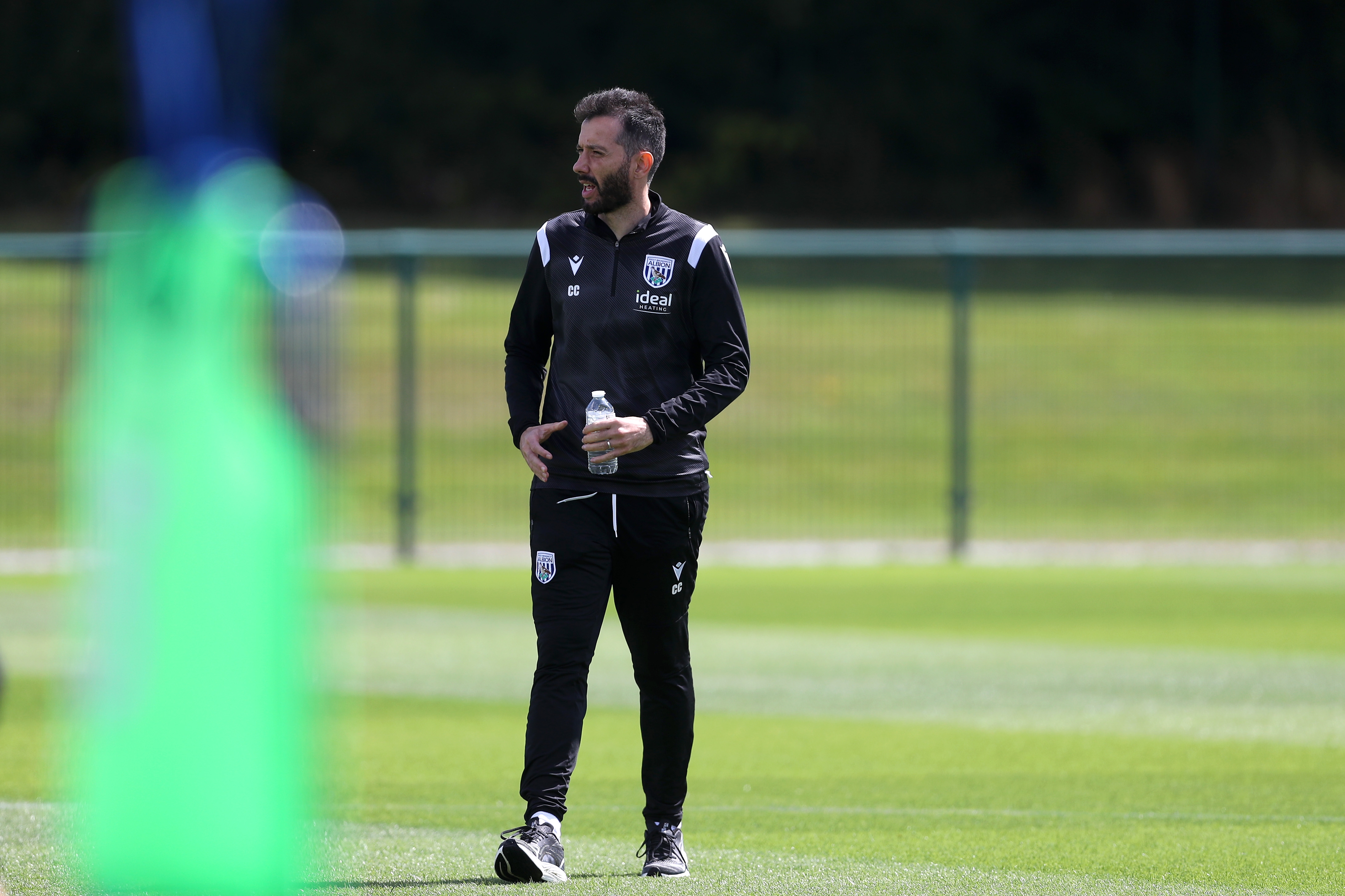 Carlos Corberán watching training 