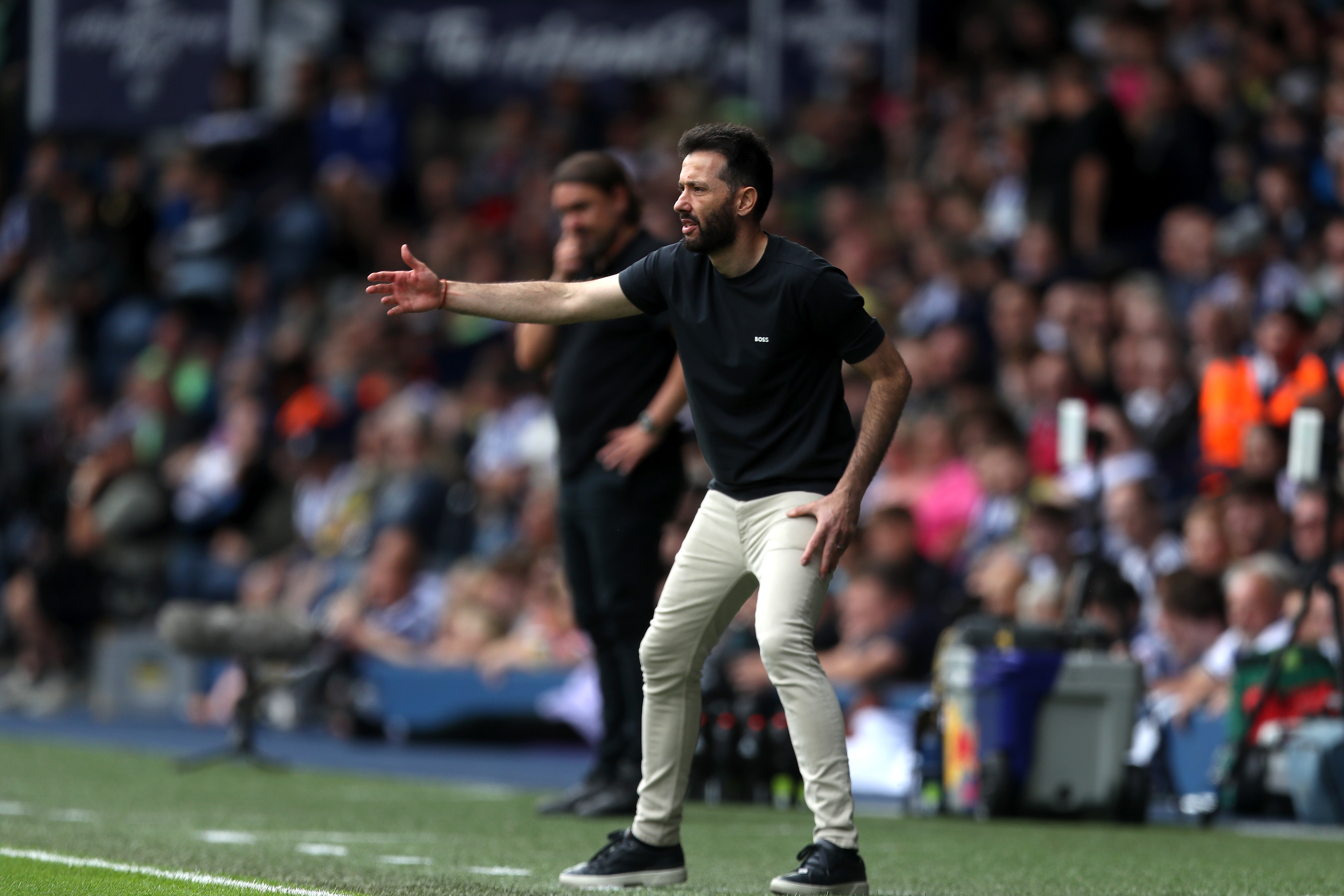 Carlos Corberán pointing while stood on the sideline at The Hawthorns against Leeds 