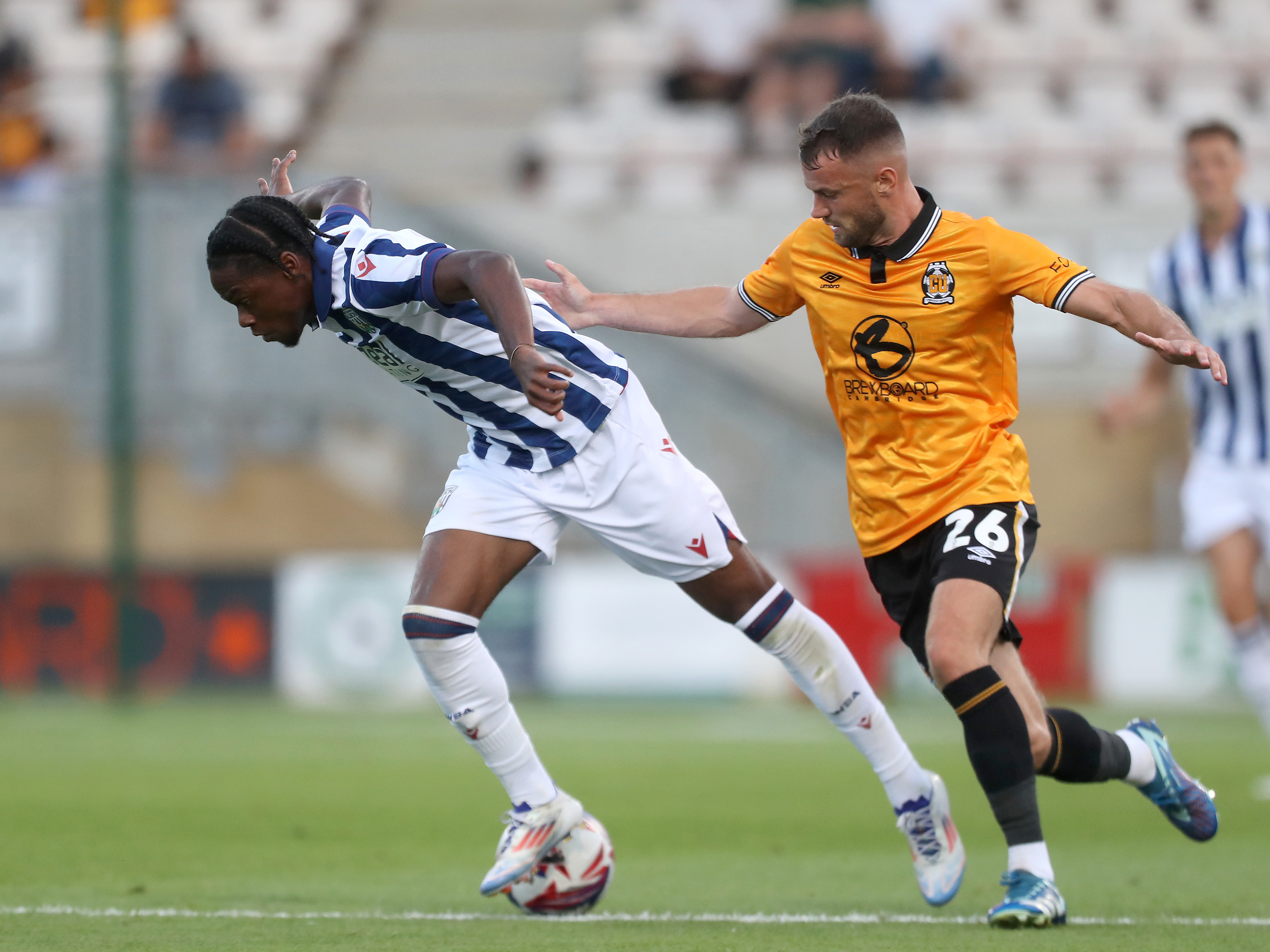 A photo of Akeel Higgins in action against League One Cambridge in a 2024/25 friendly