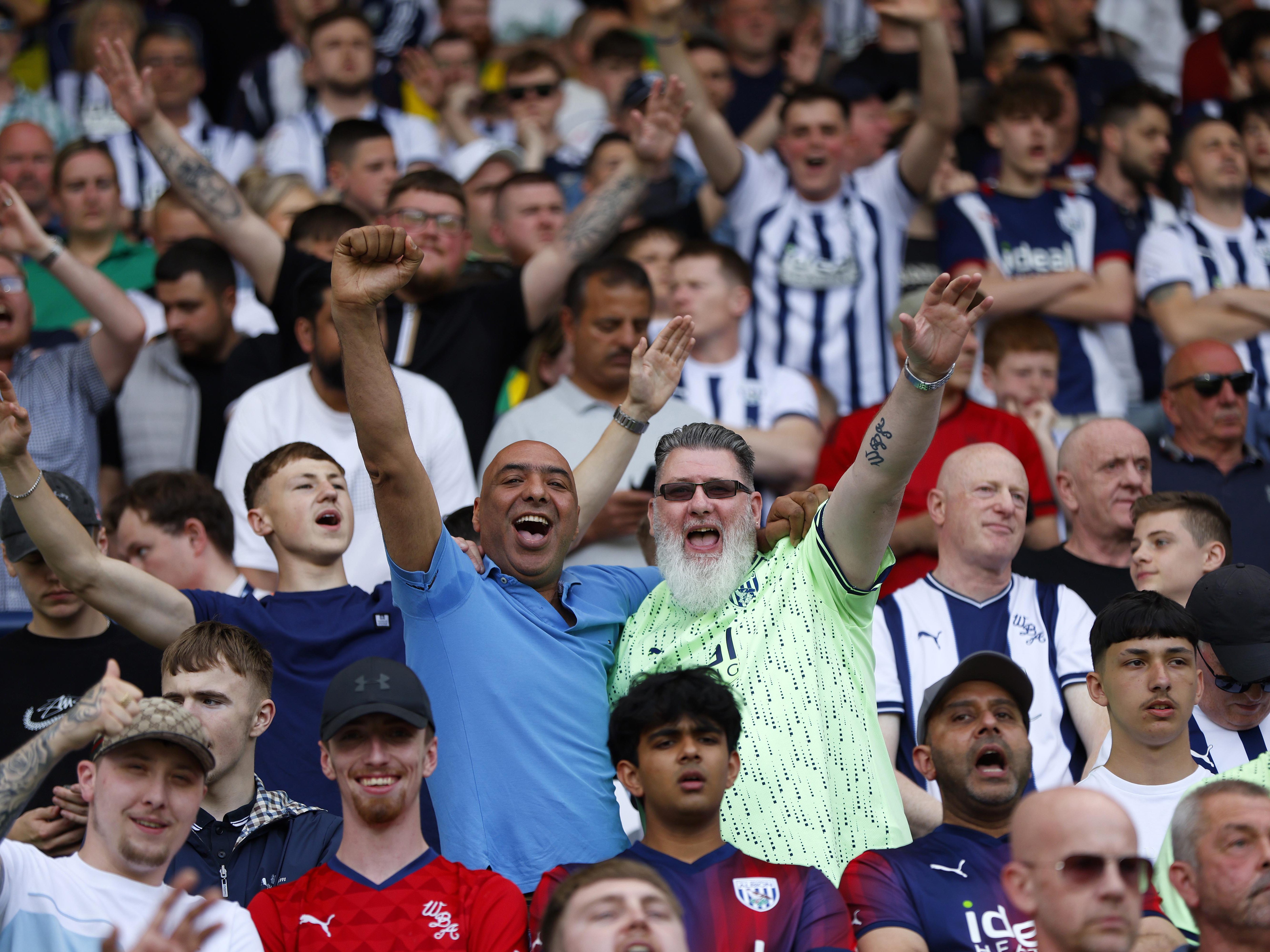 An image of Albion supporters cheering on their team