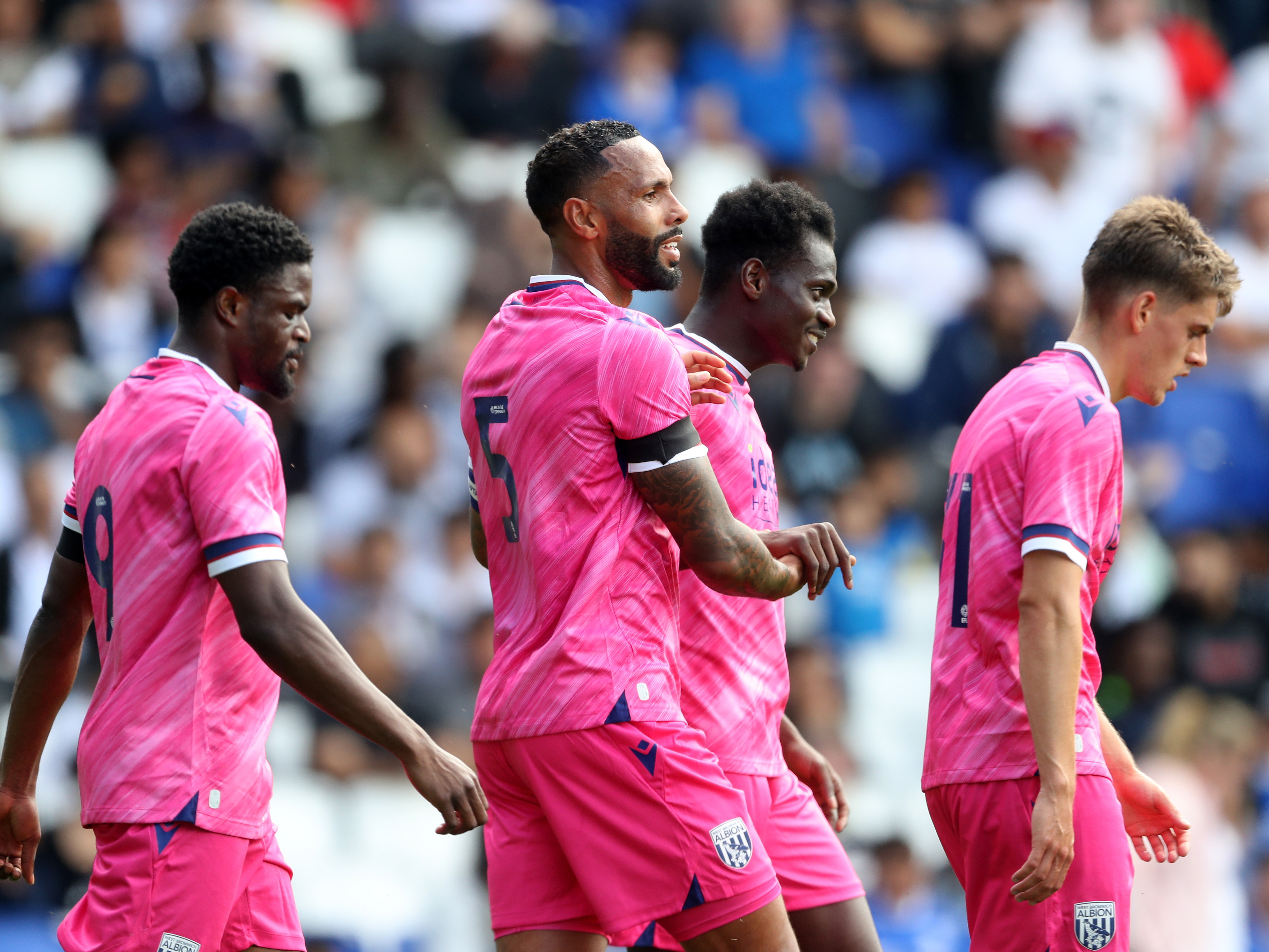 An image of Kyle Bartley and his teammates celebrating a goal against Blues