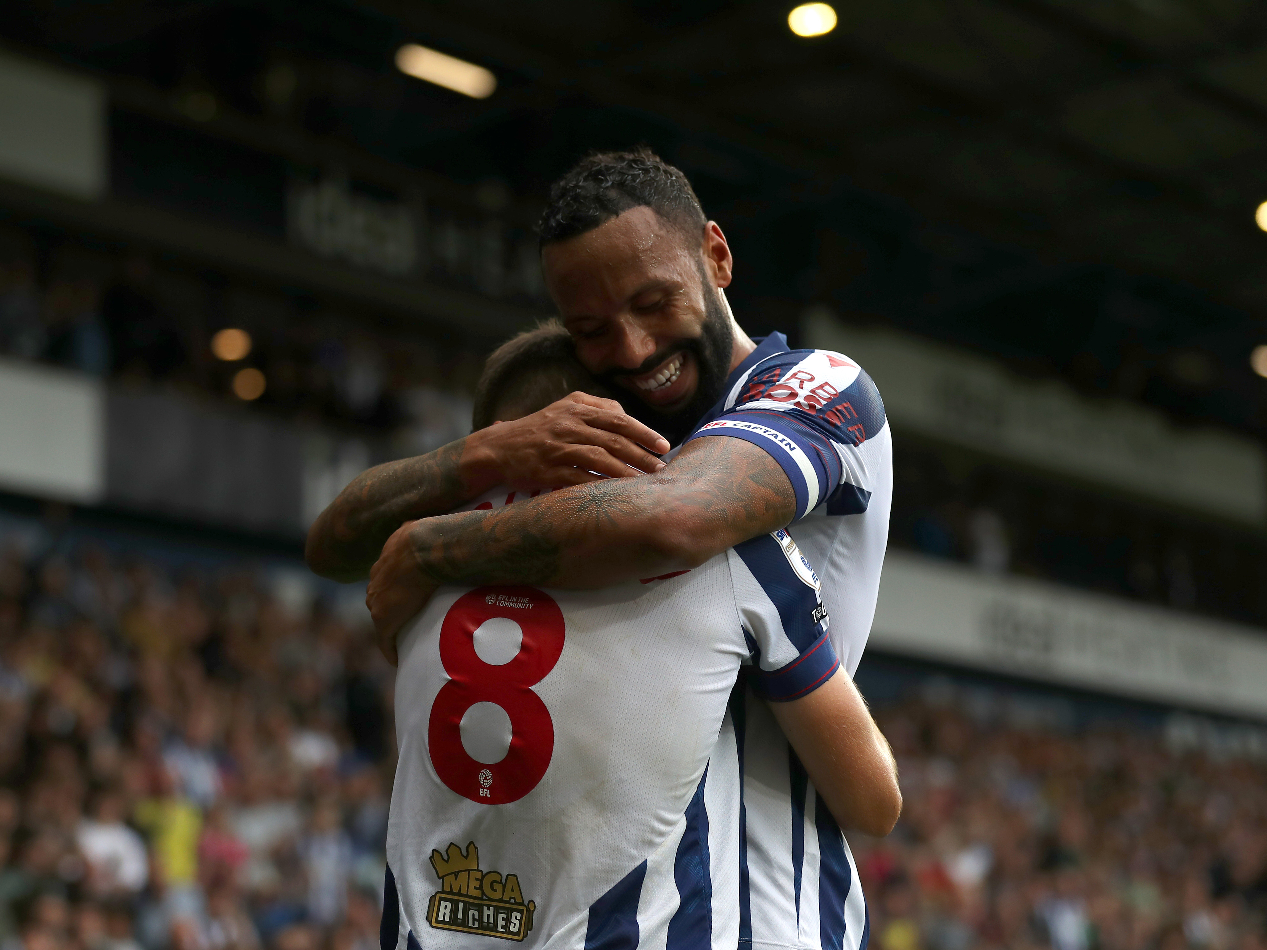 An image of Kyle Bartley and Jayson Molumby celebrating a goal