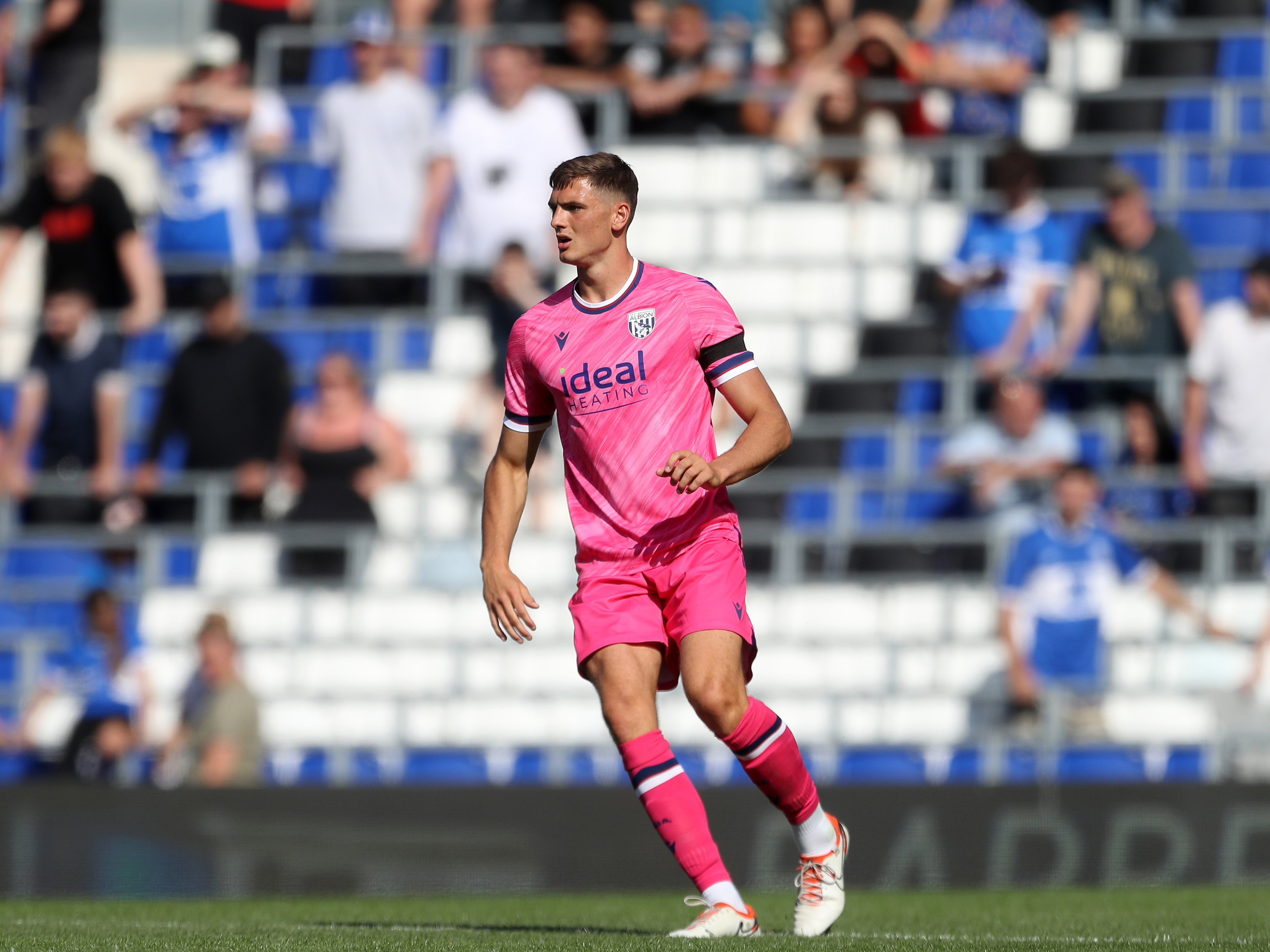 Caleb Taylor in action for Albion wearing the pink away kit 