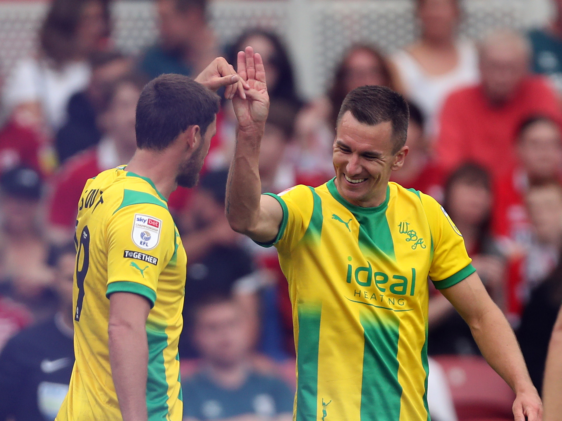 John Swift celebrates with Jed Wallace after scoring at Middlesbrough in 2022