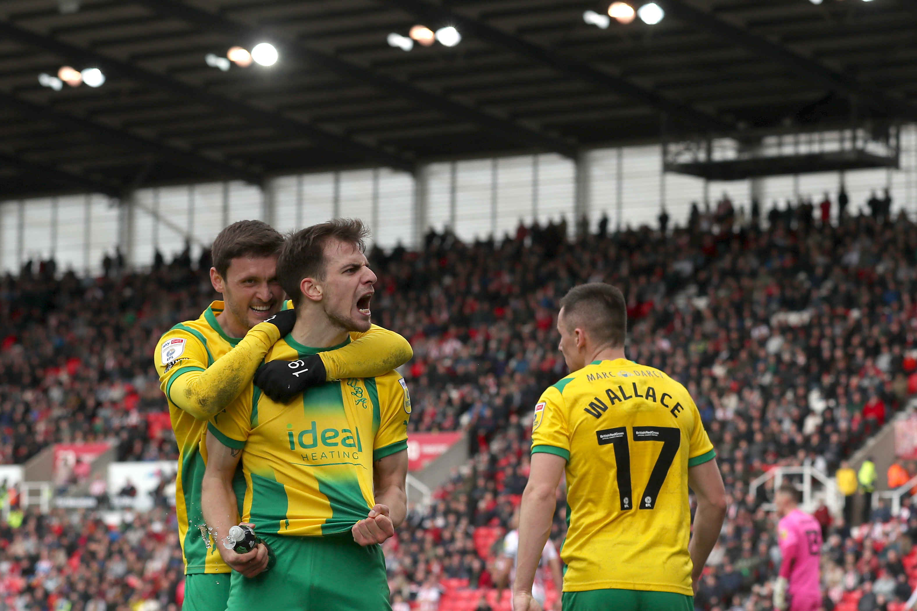 Jayson Molumby celebrates scoring at Stoke City in April 2023 with John Swift 