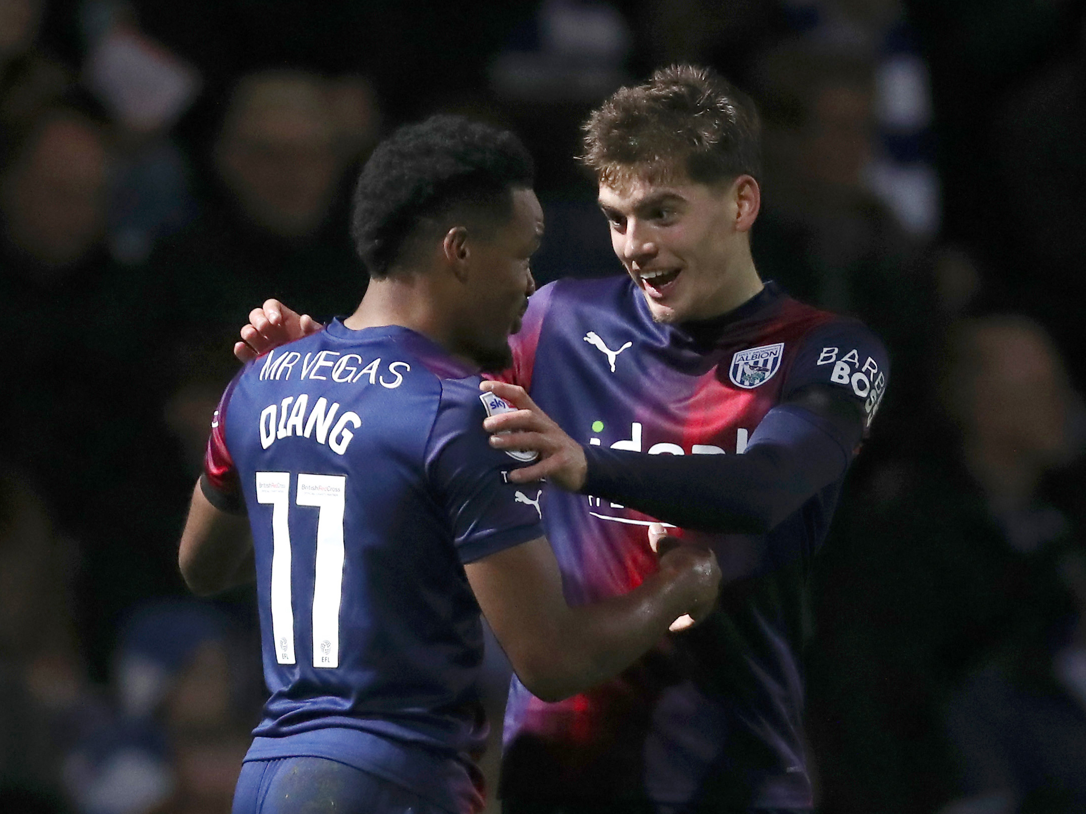 Grady Diangana celebrates with Tom Fellows after scoring at QPR in March 2024