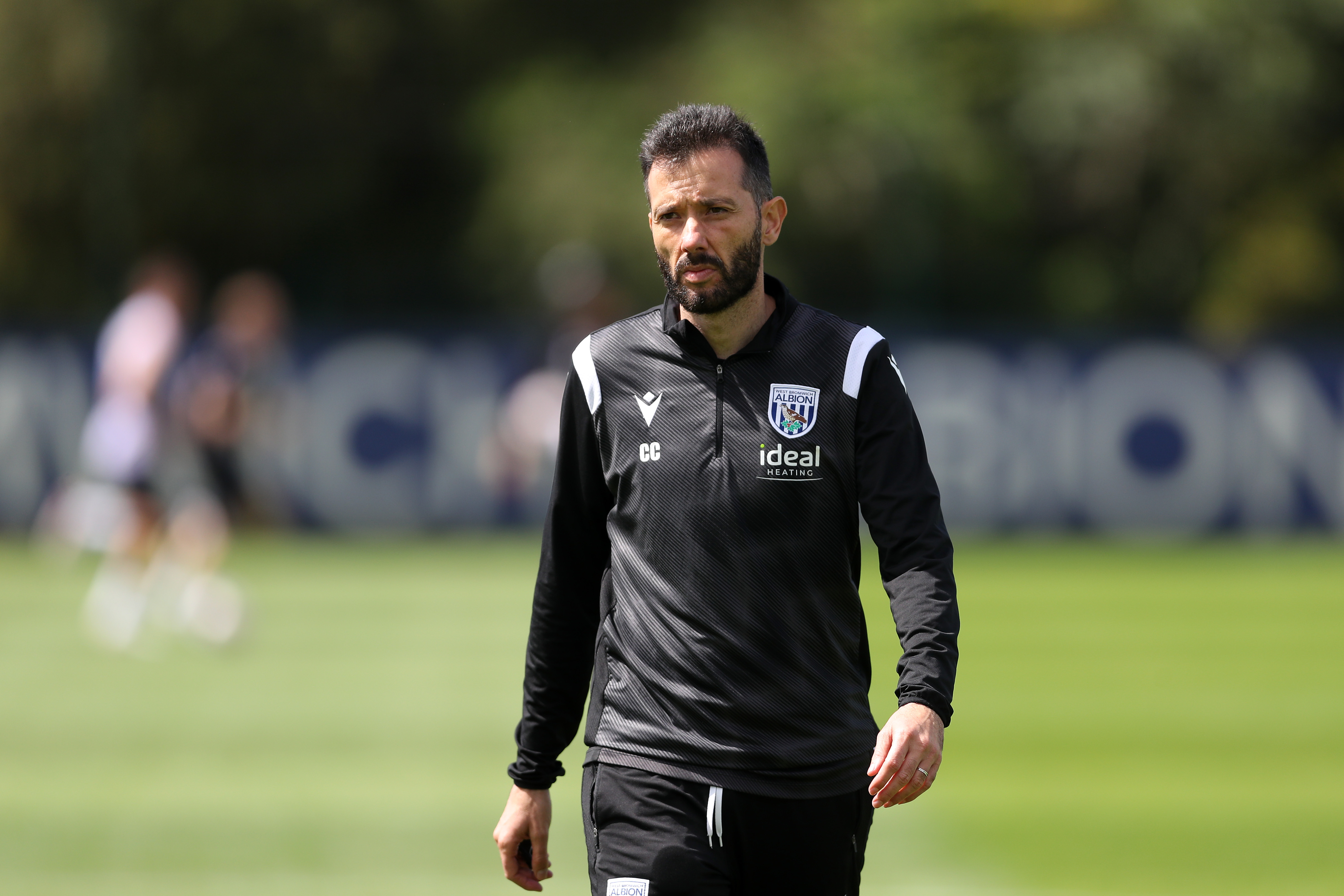 Carlos Corberán watching training 