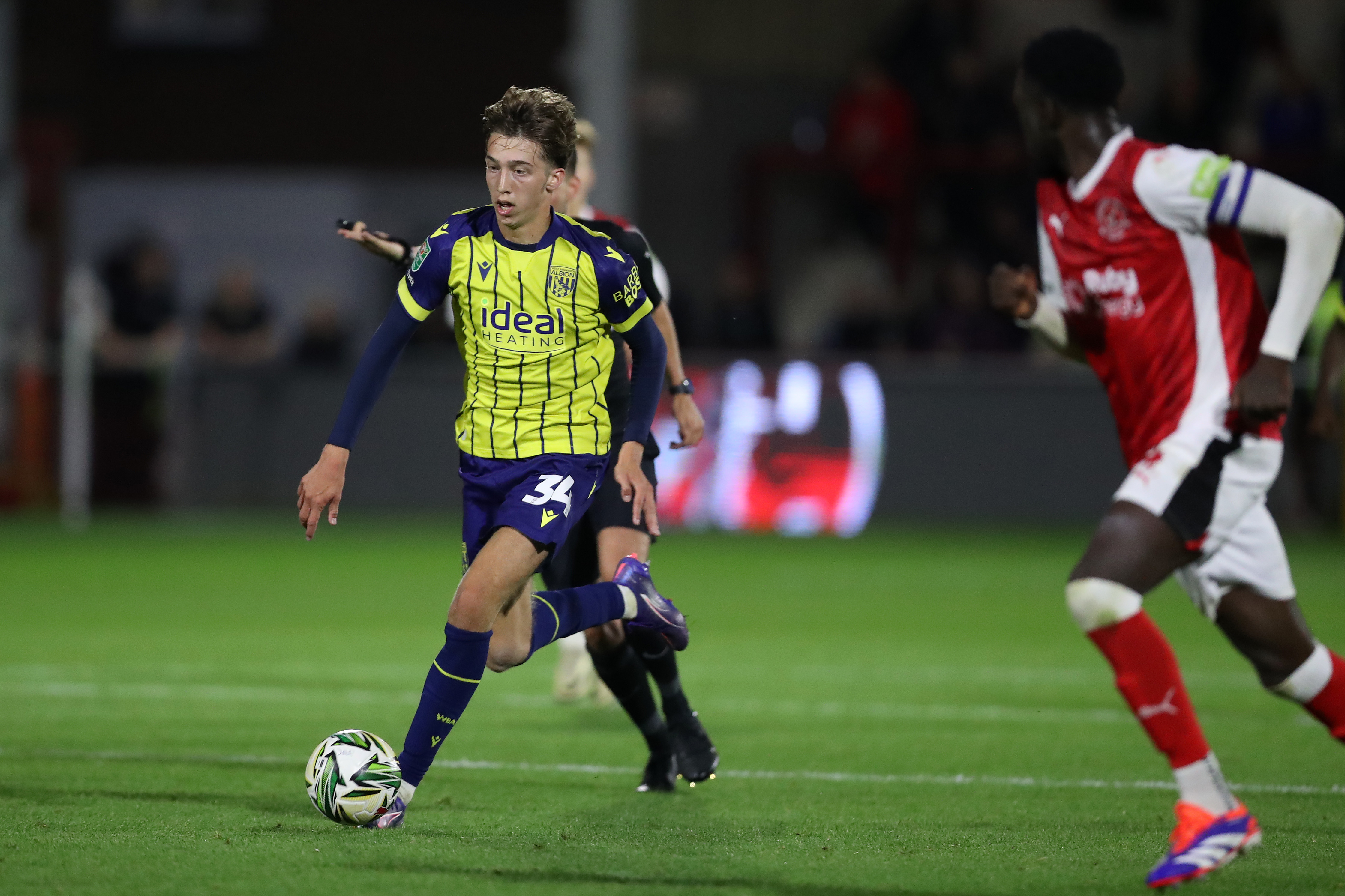 Harry Whitwell in the yellow away shirt in action against Fleetwood Town 