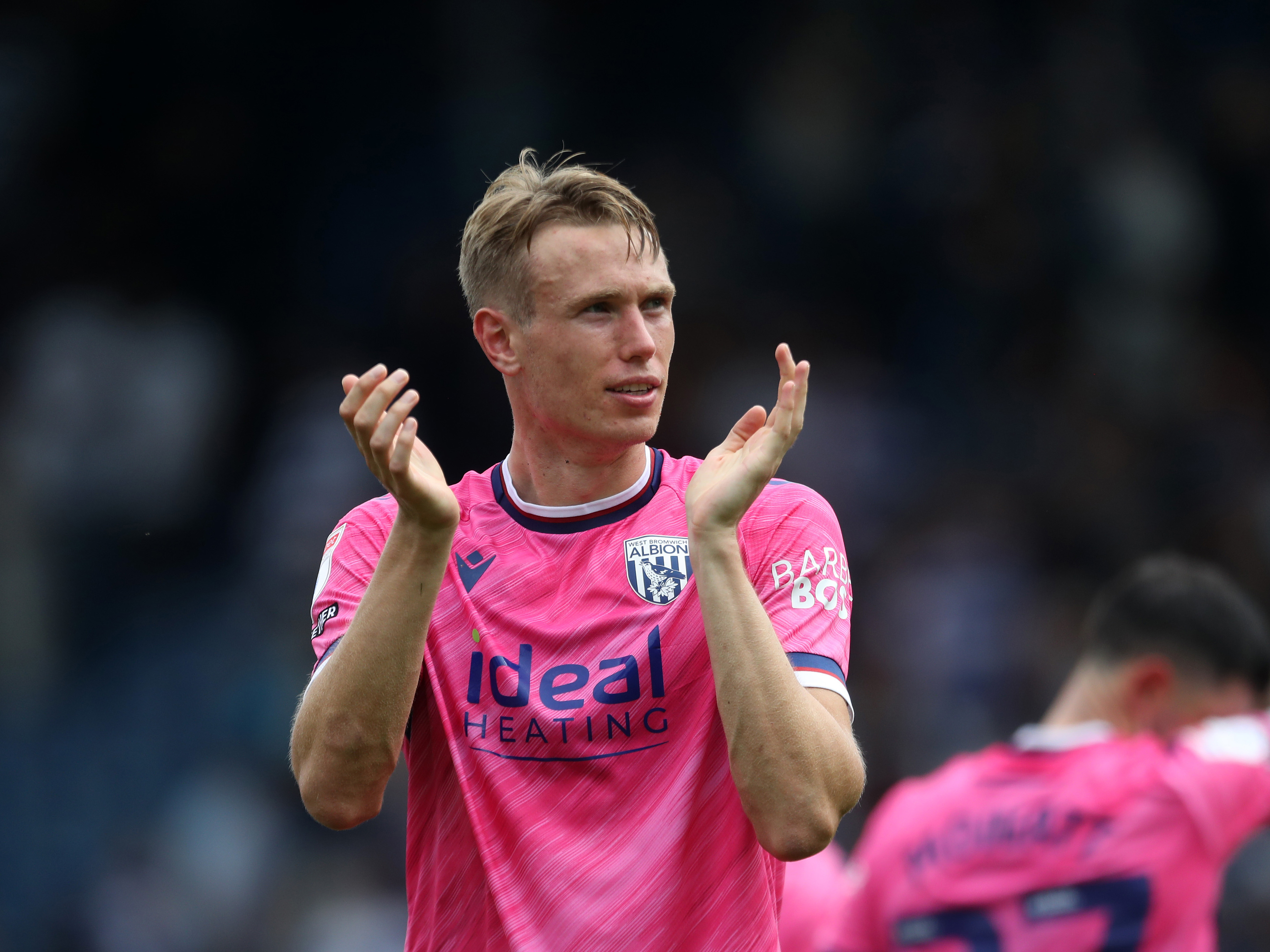 A photo of Torbjorn Heggem applauding Albion fans at QPR