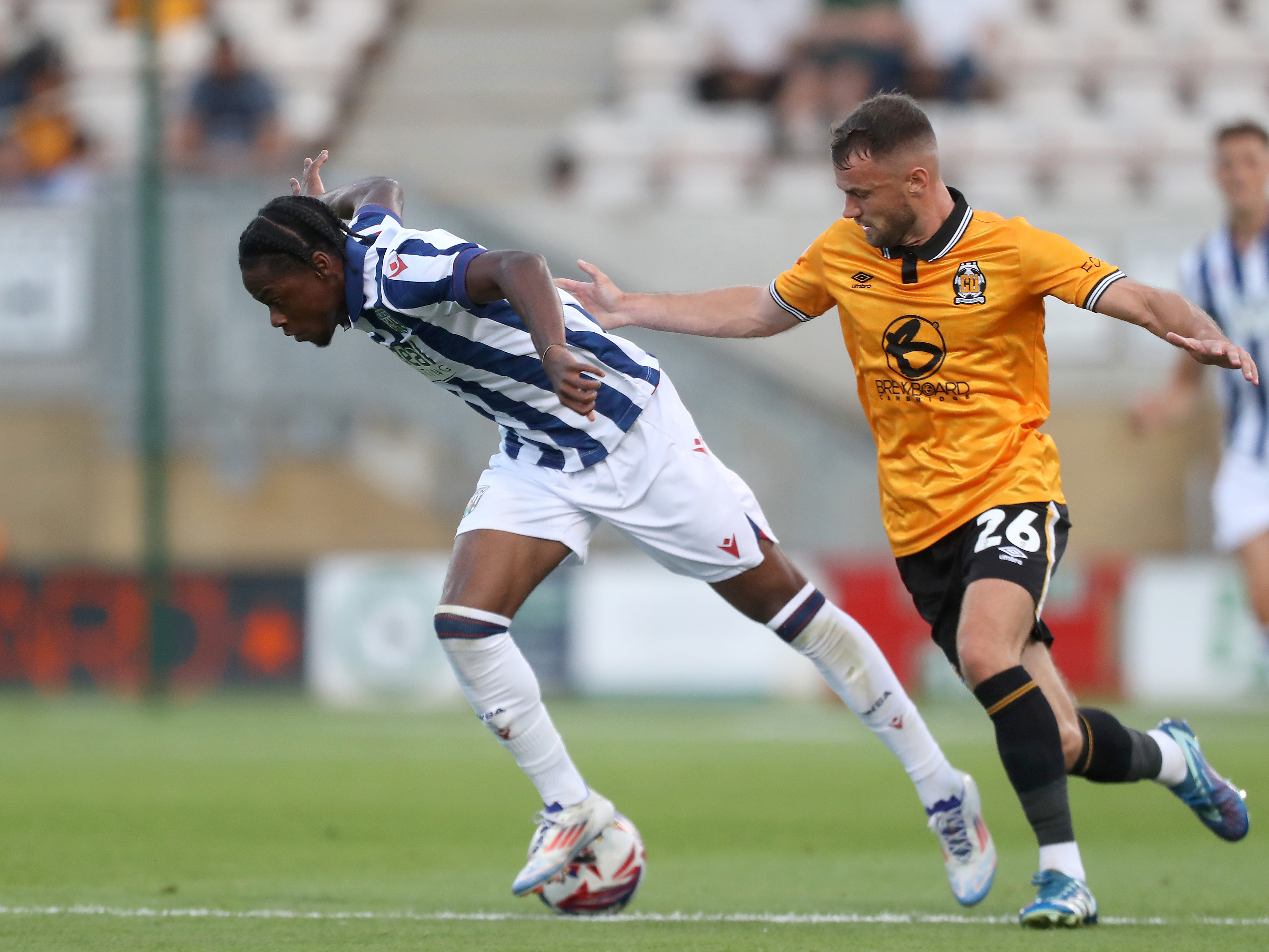 Akeel Higgins in action against Cambridge United in a pre-season friendly in the home shirt 