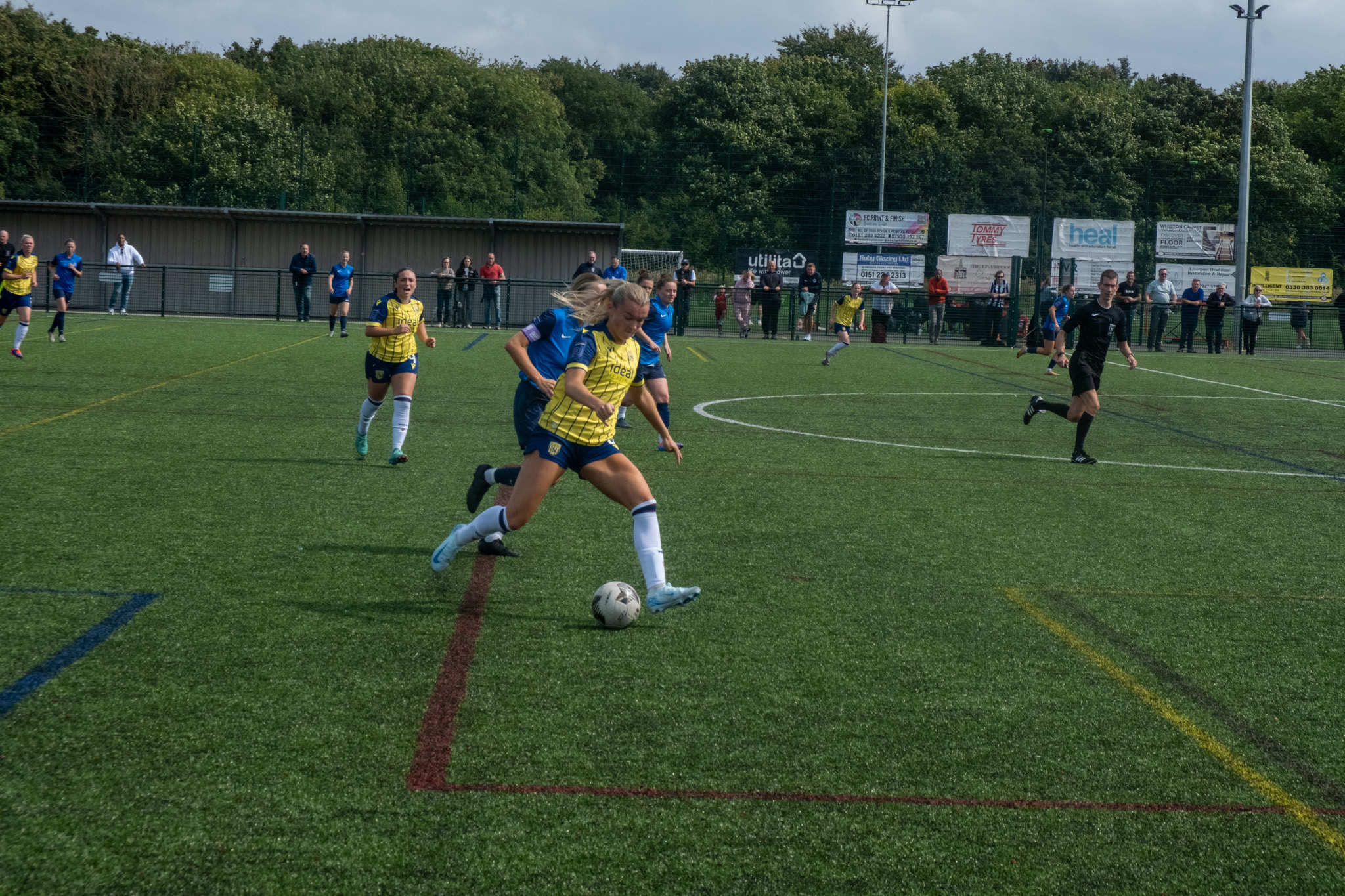 Taylor Reynolds lofts a pass forward against Liverpool Feds.