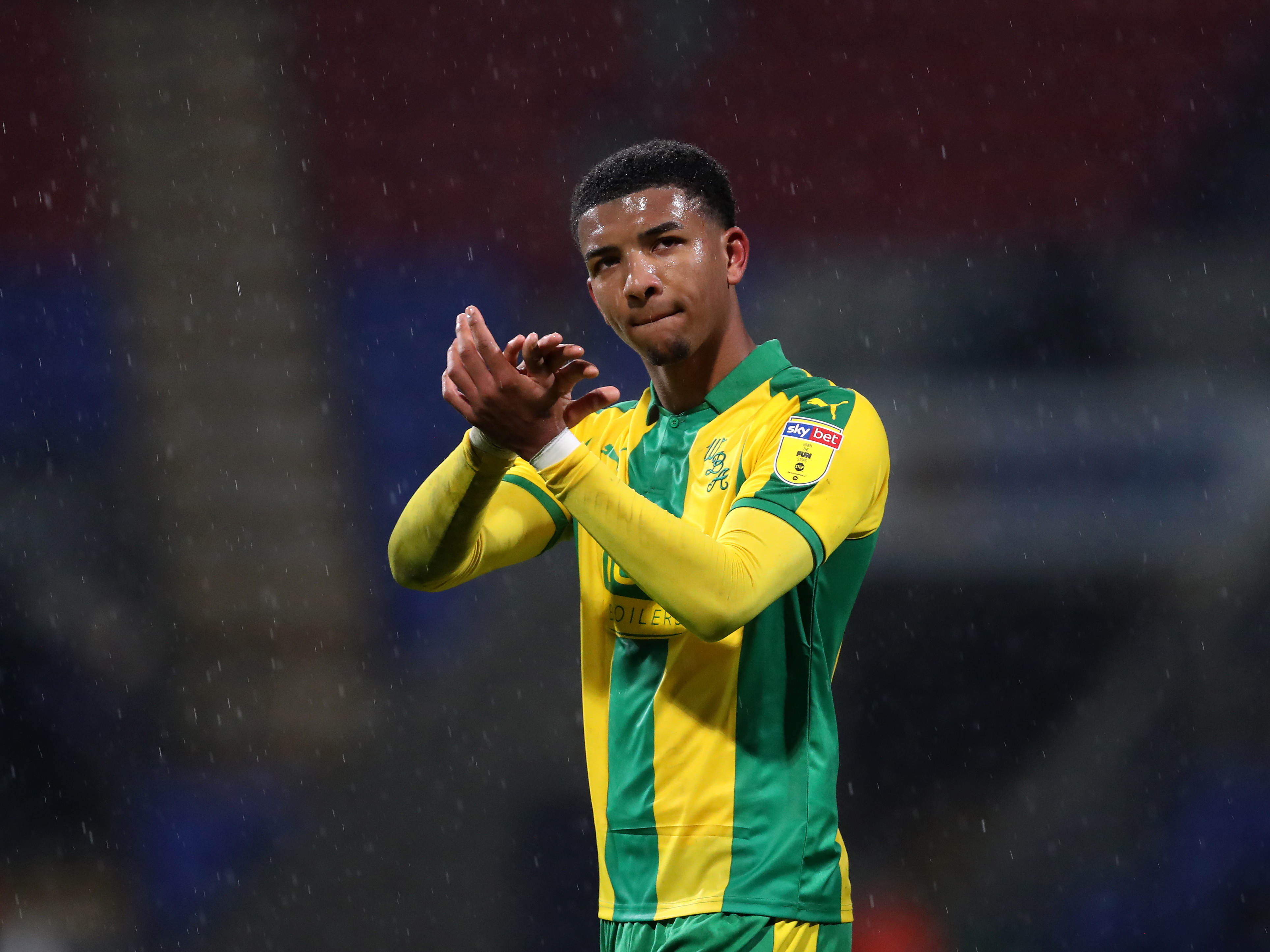 An image of Mason Holgate applauding Albion supporters during his last spell at the club