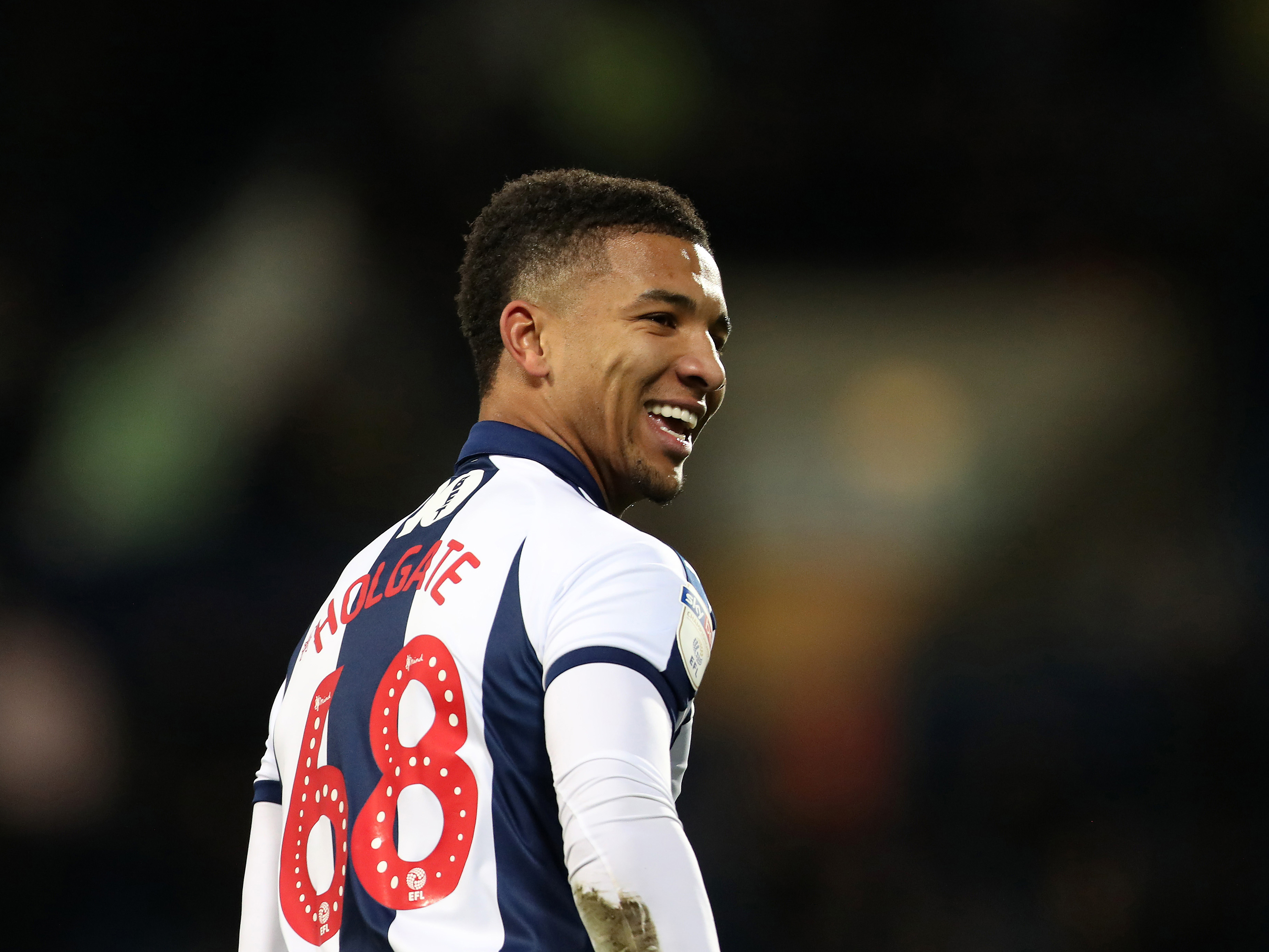 An image of Mason Holgate smiling during his previous spell at Albion