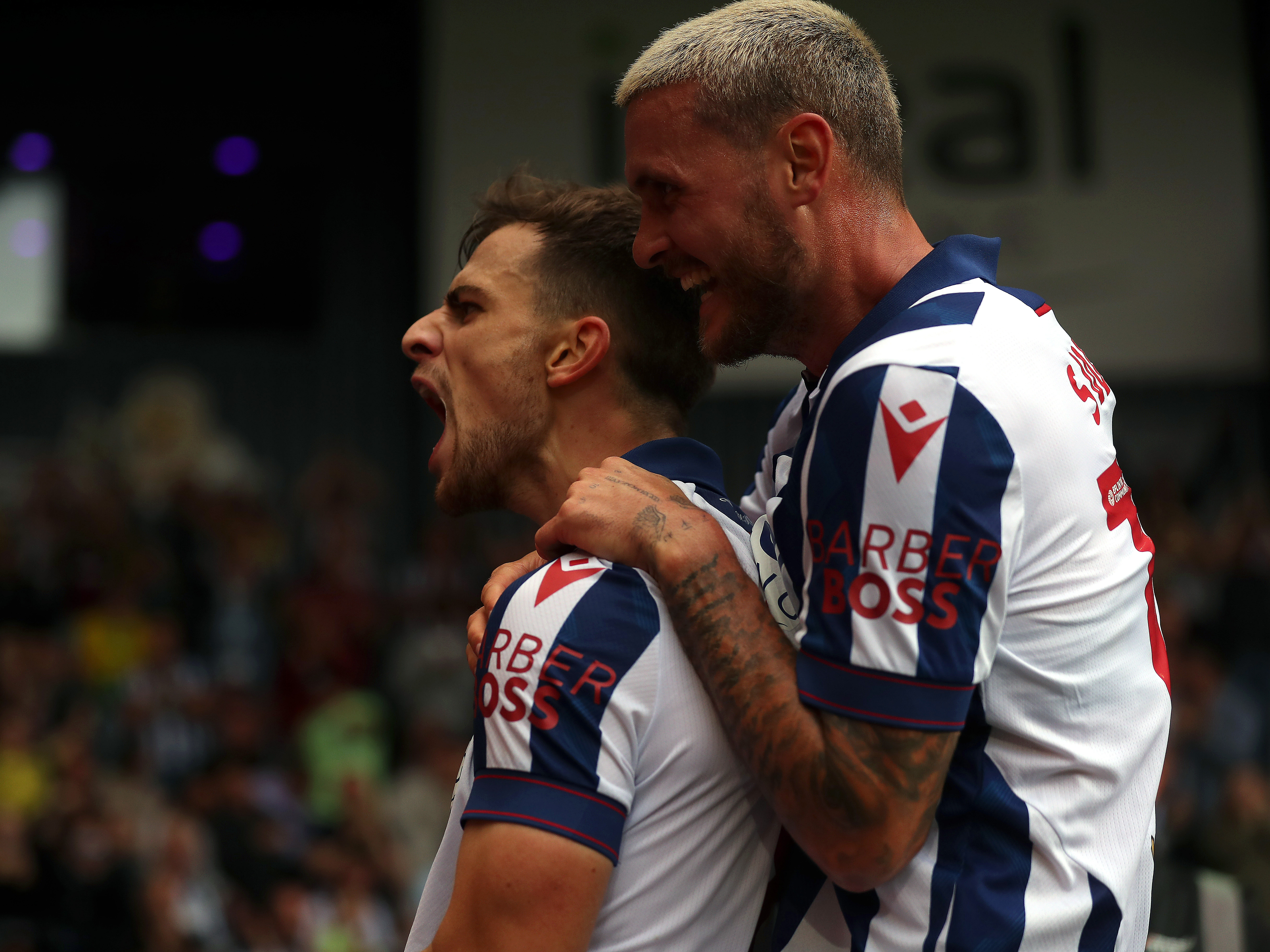 An image of John Swift and Jayson Molumby celebrating a goal