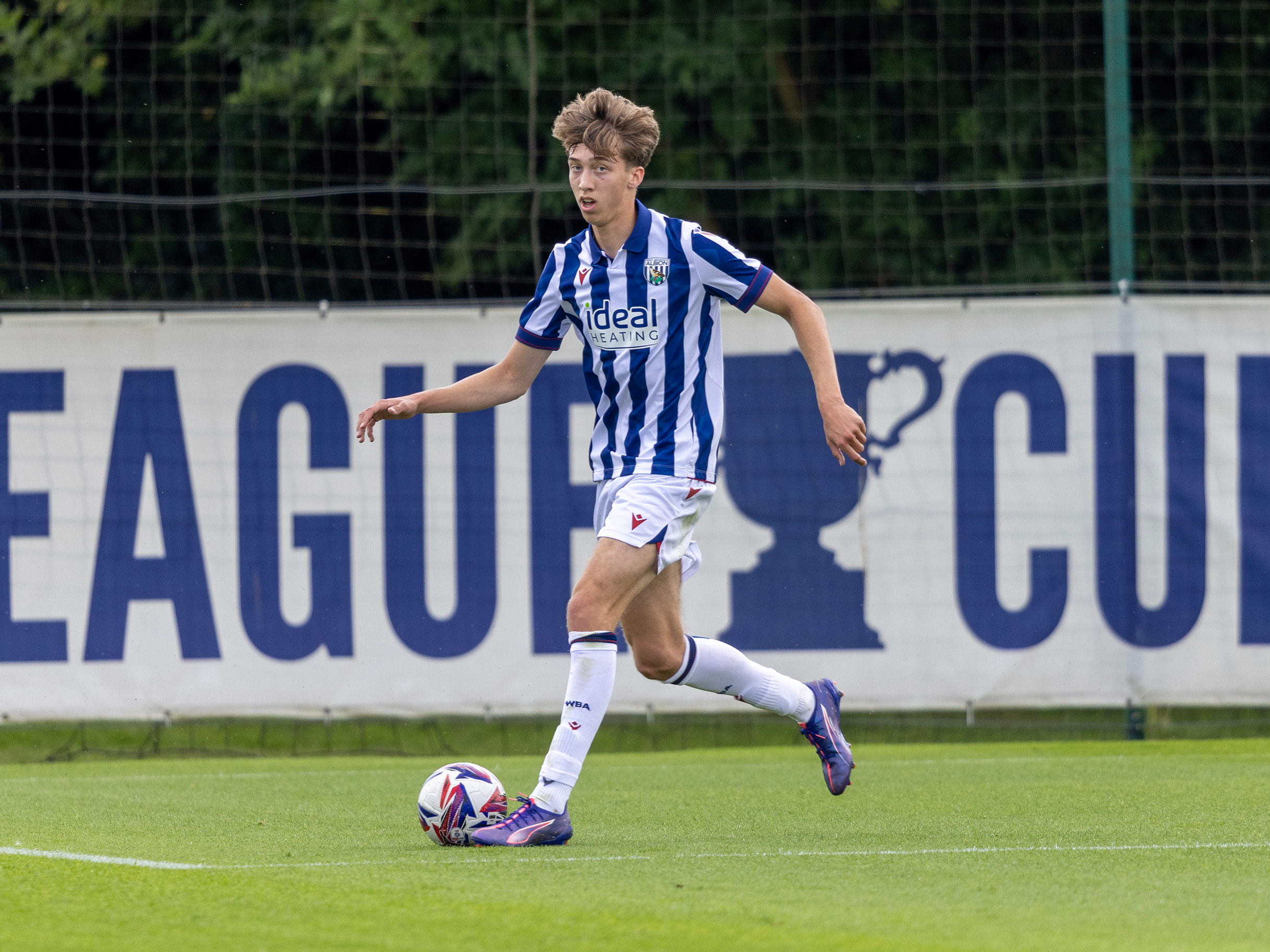 A photo of Albion youngster Harry Whitwell, in the 2024/25 home kit, playing at the club's training ground