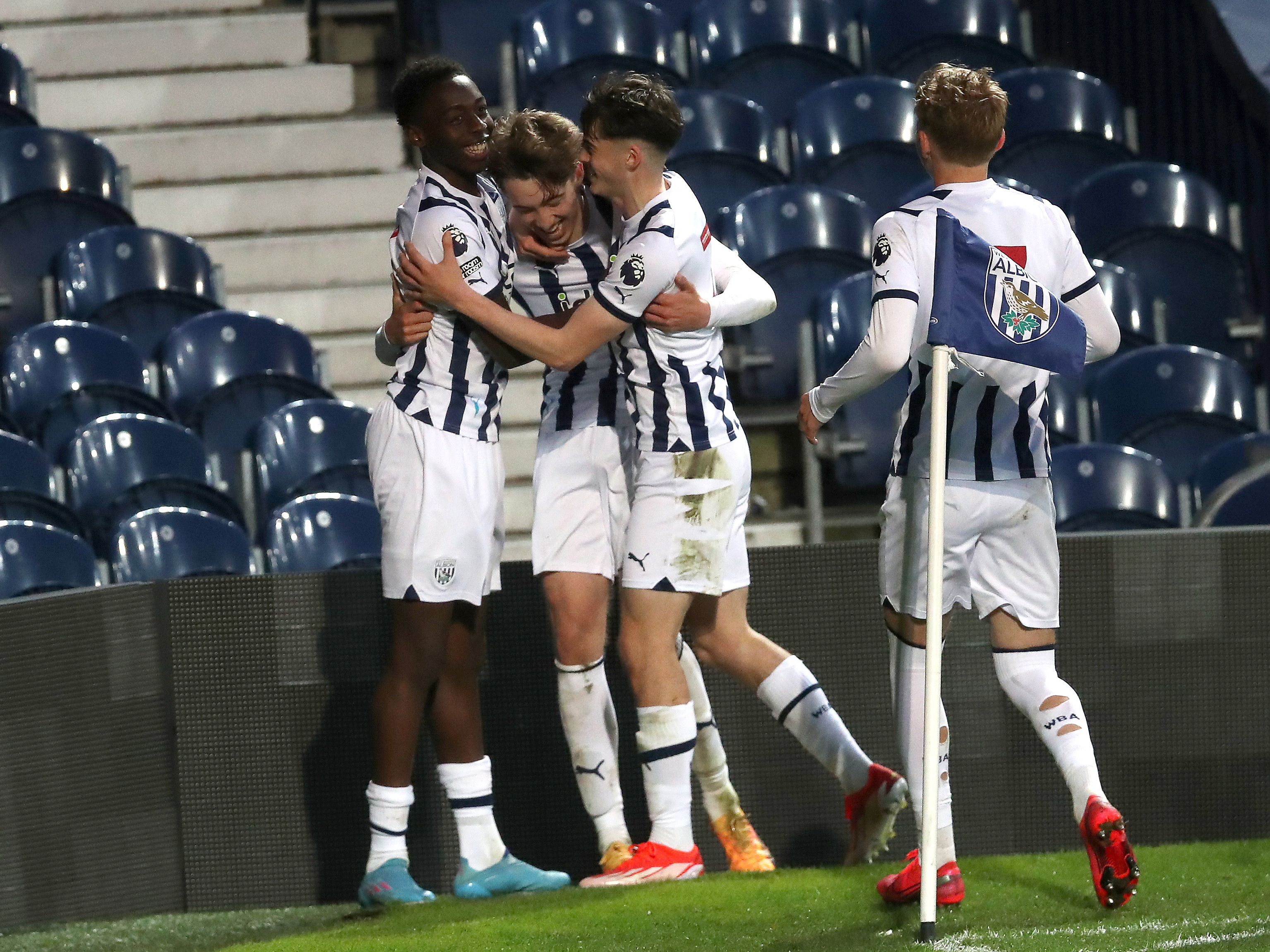 A photo of PL2 players celebrating a goal against Leeds during the final match of the 2023/24 season