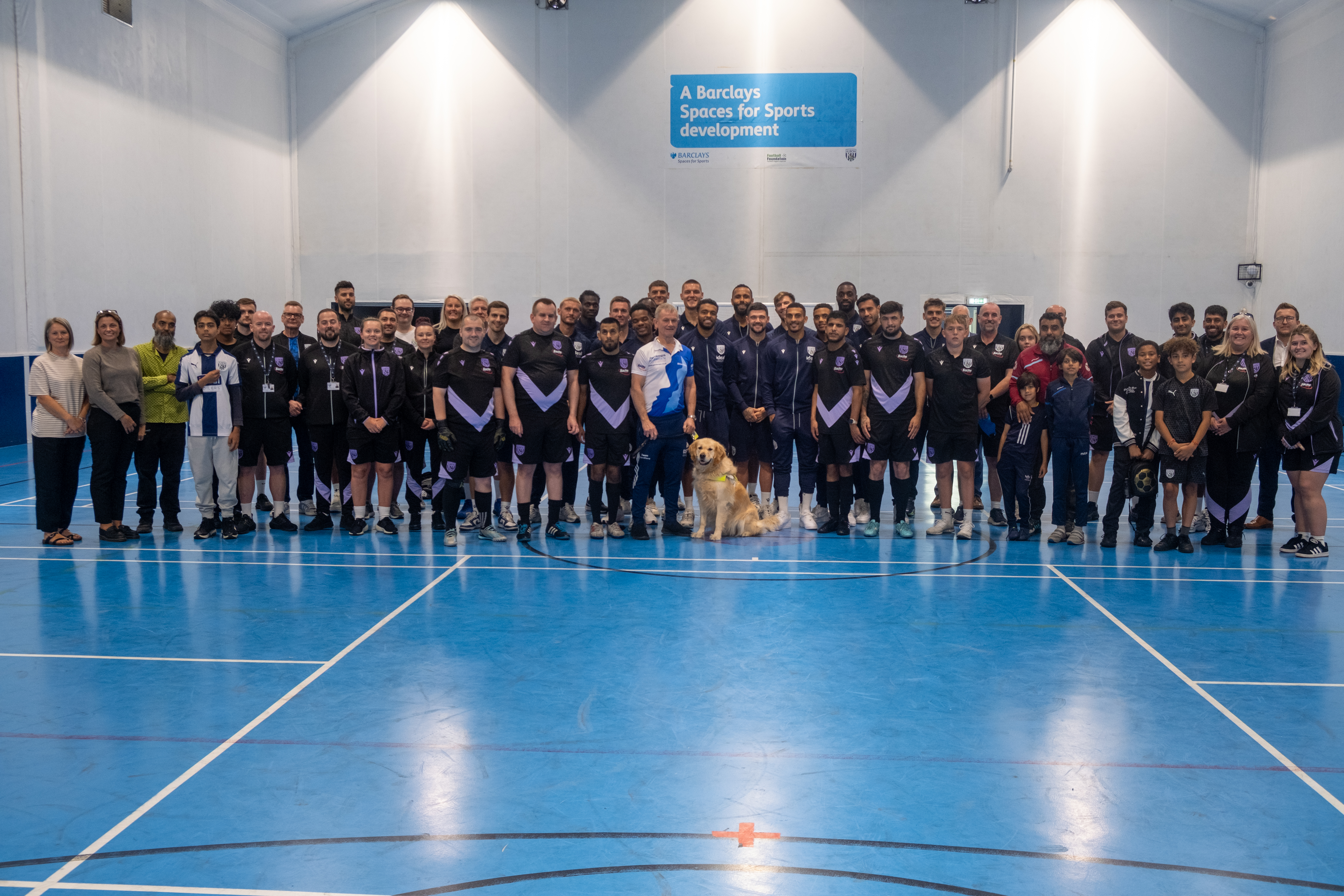 Albion first team players, Foundation staff, Albion Blind, Proud Baggies, All Access Albion, Go Local groups and "Blind" Dave Heeley pose for a photo.