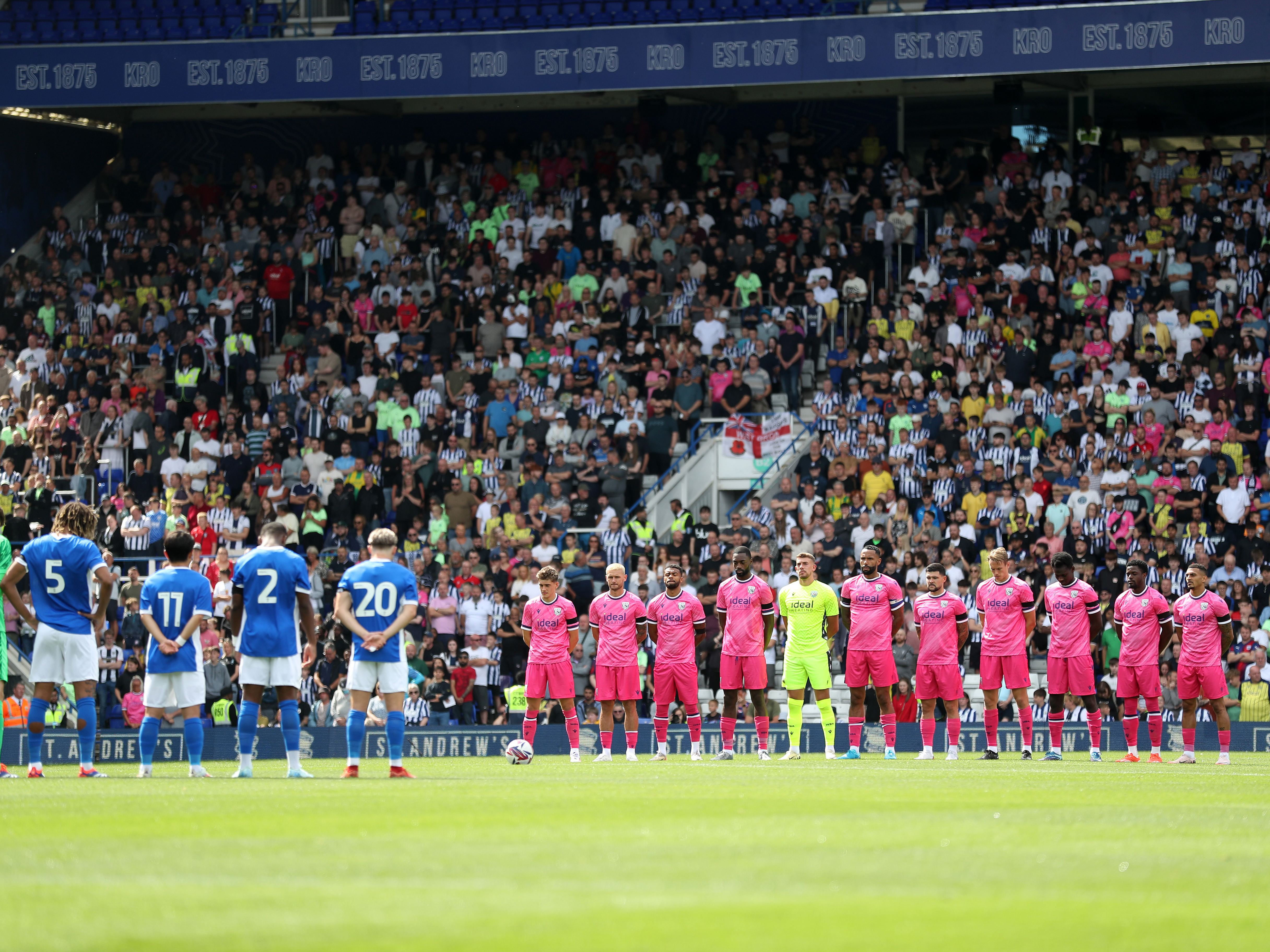 An image of Albion and Blues players during a minute's silence for Craig Shakespeare