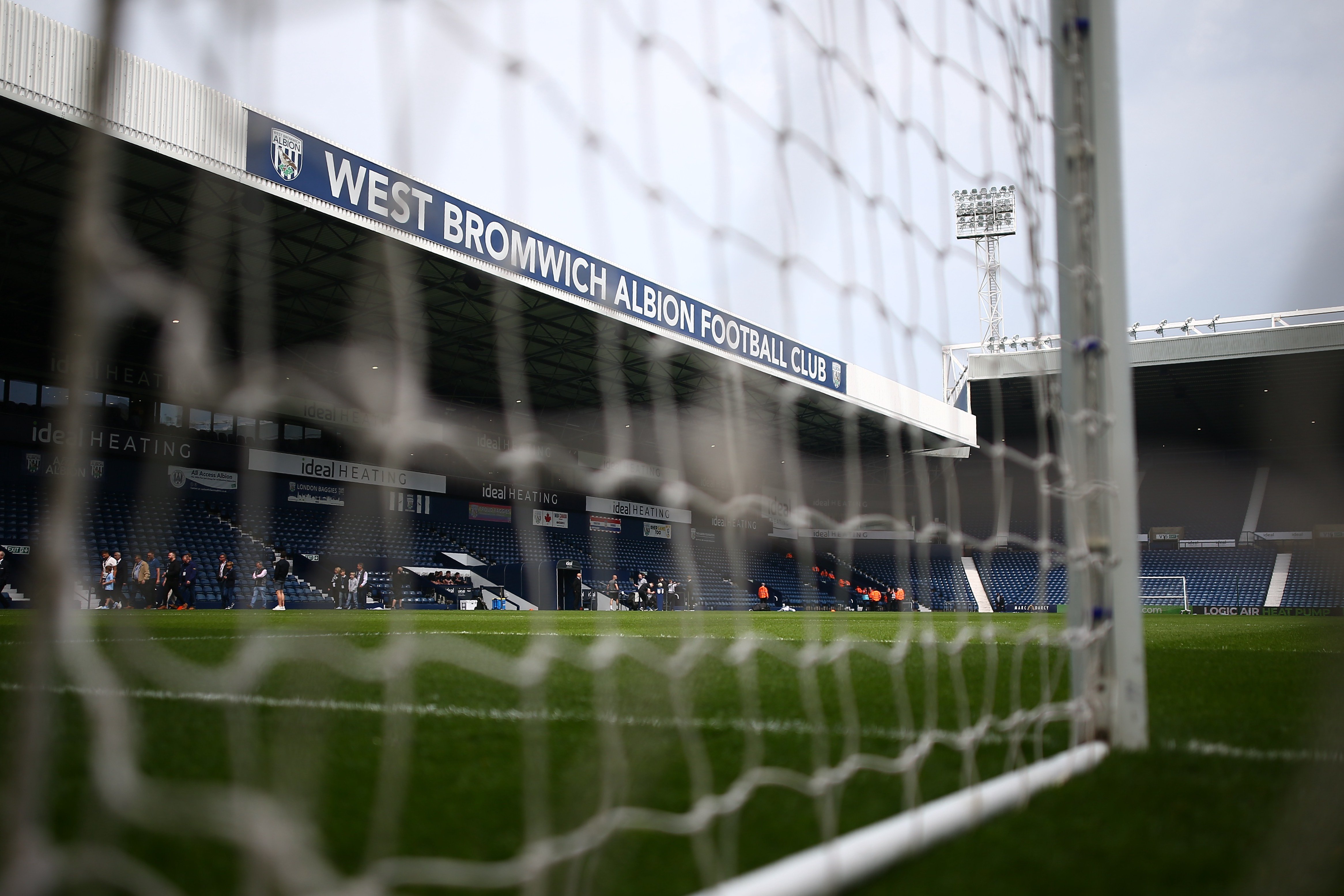 a general view of the Halfords Lane stand at The Hawthorns shot through a goal net 