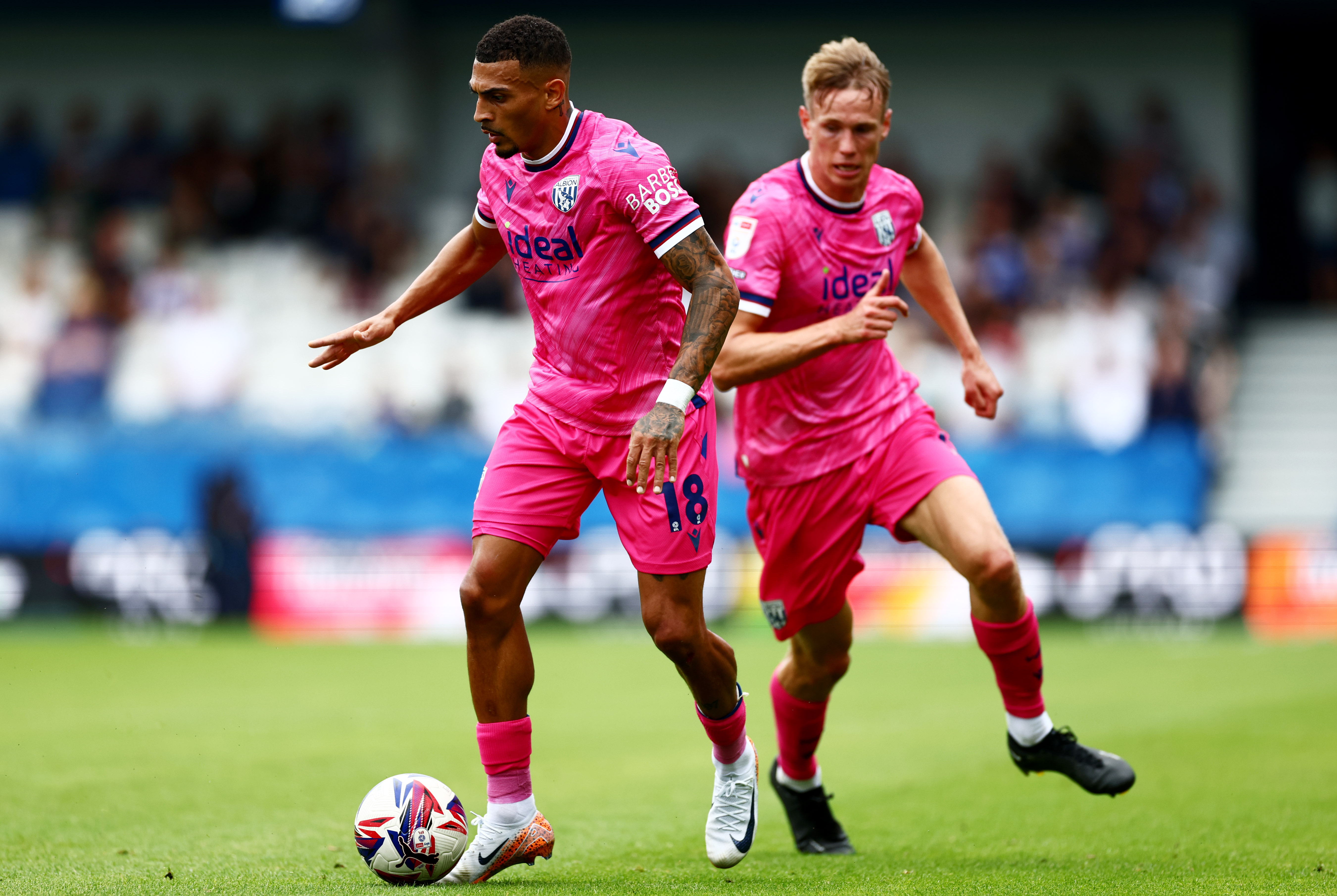 Karlan Grant on the ball at QPR with Torbjørn Heggem behind him 