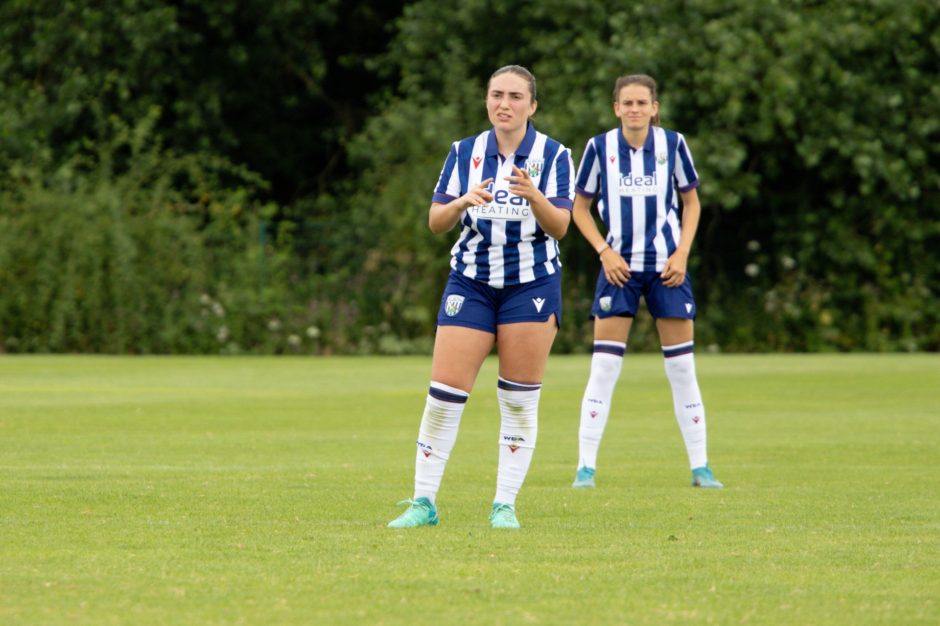 Fran Orthodoxou of Albion Women in-front of Izzy Green.