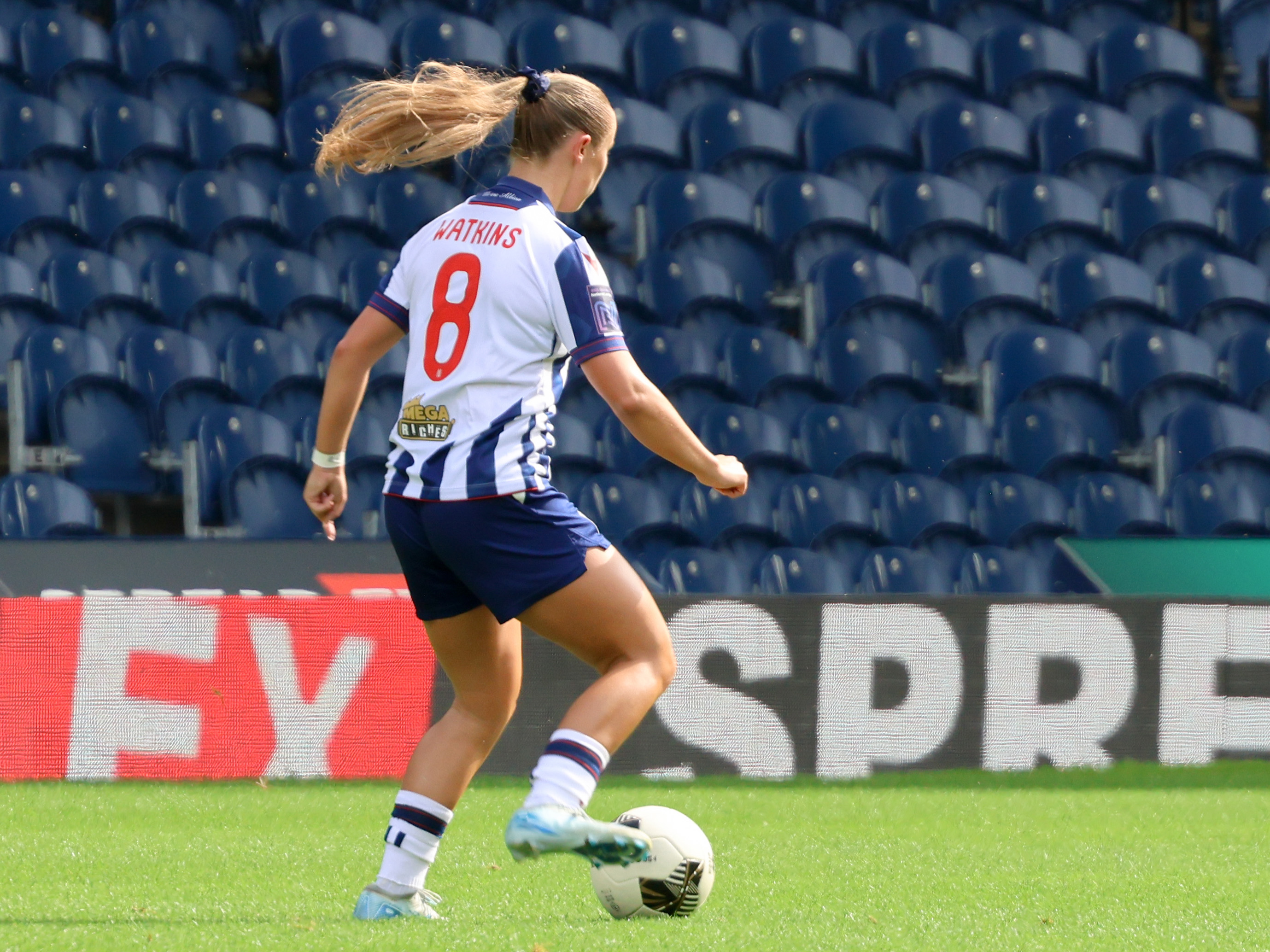 Seren Watkins in action for Albion Women wearing the home kit 