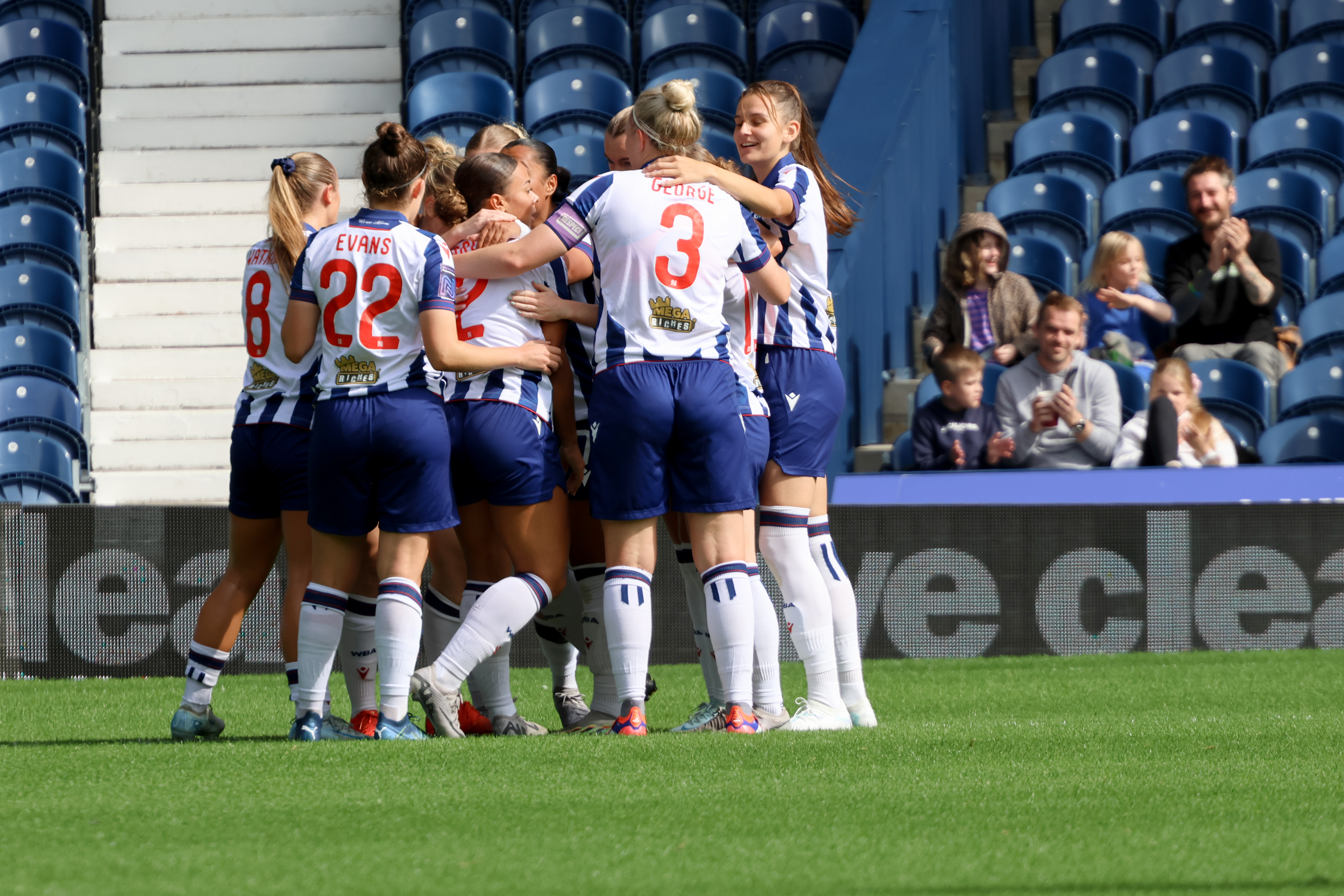 Several Albion Women players celebrate after the team scored a goal against Sporting Khalsa at The Hawthorns