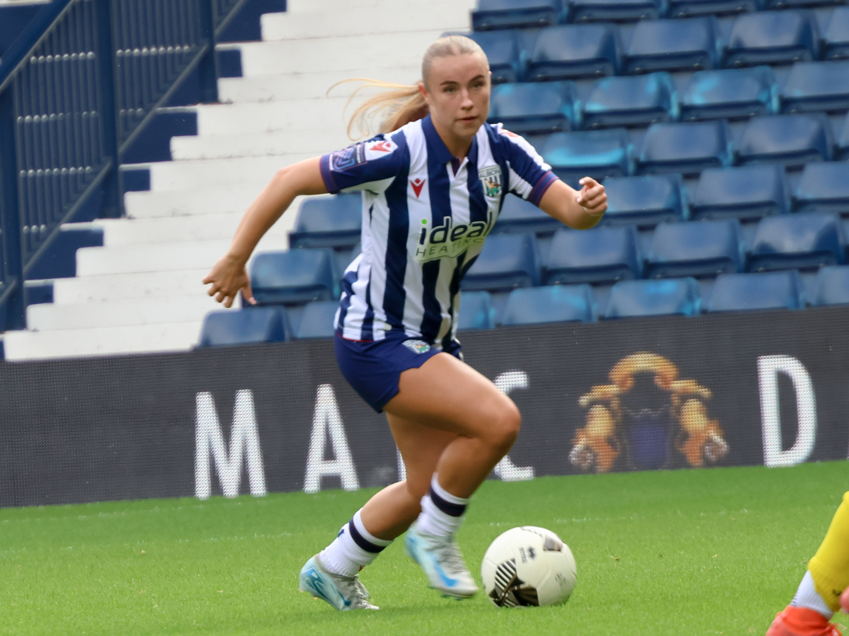 Seren Watkins in action for Albion Women wearing the home kit 