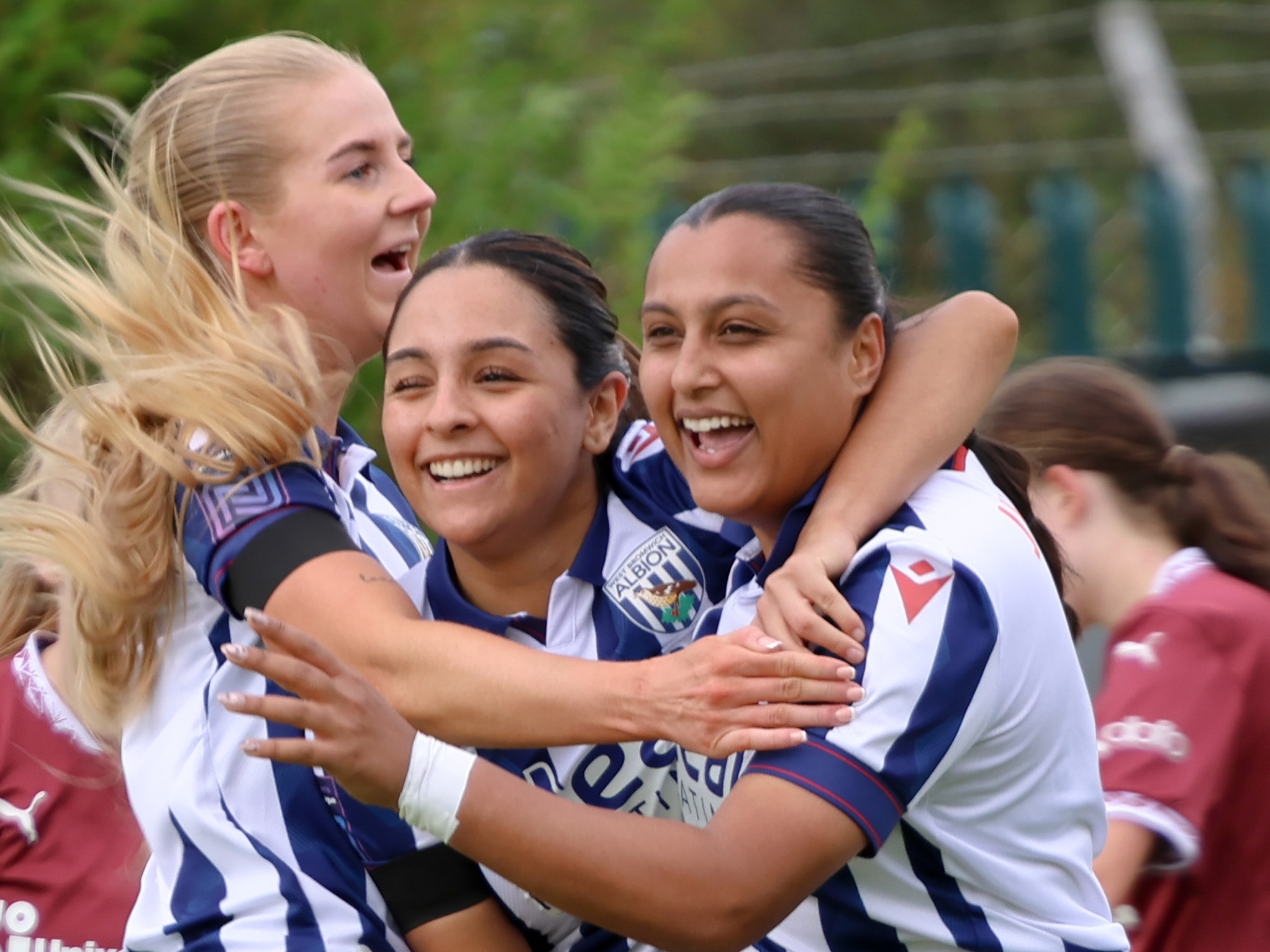 Simran Jhamat (right) celebrates with Maz Mahmood and Rhianne Oakley after scoring for Albion Women 