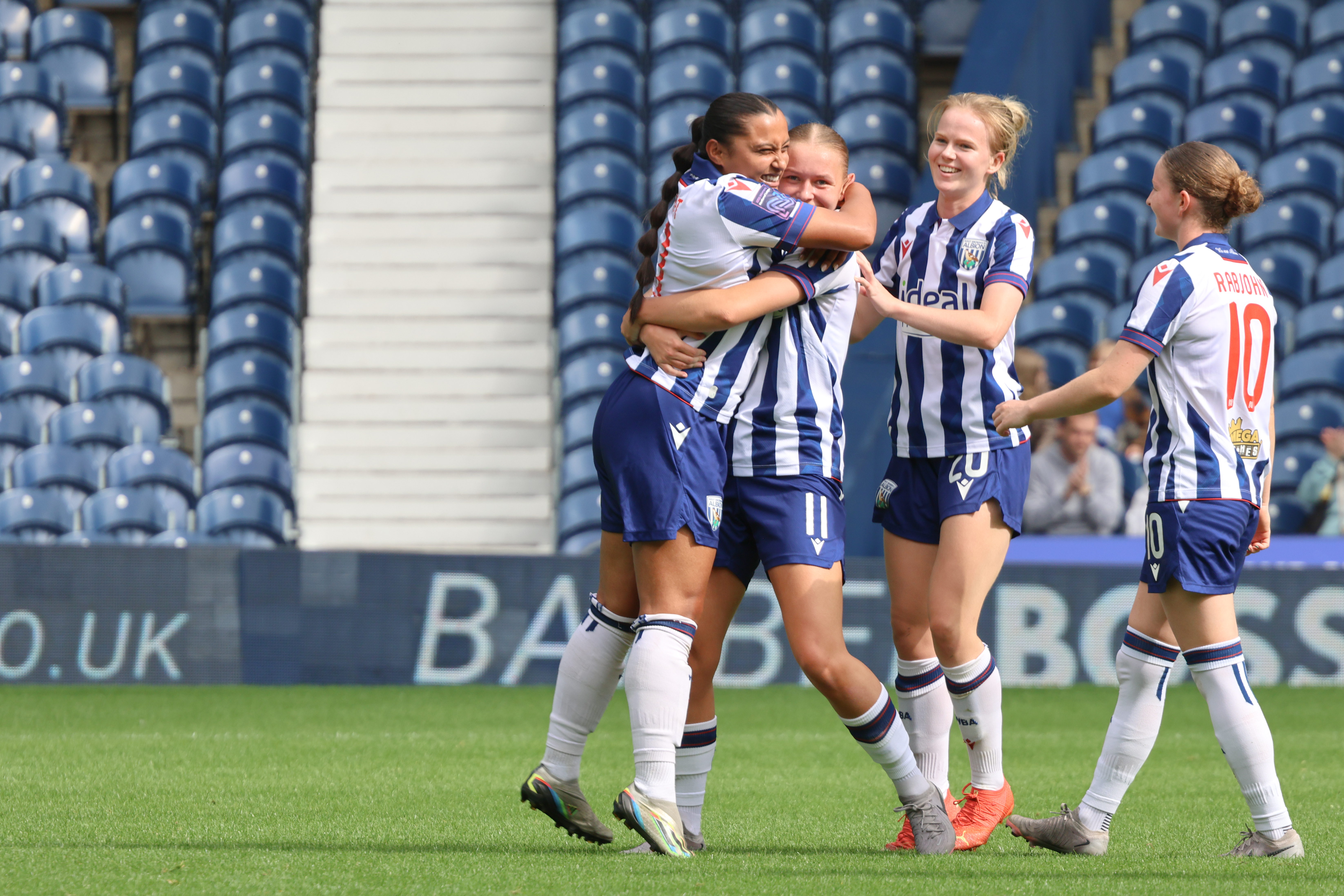 Albion Women celebrate their second goal against Sporting Khalsa.