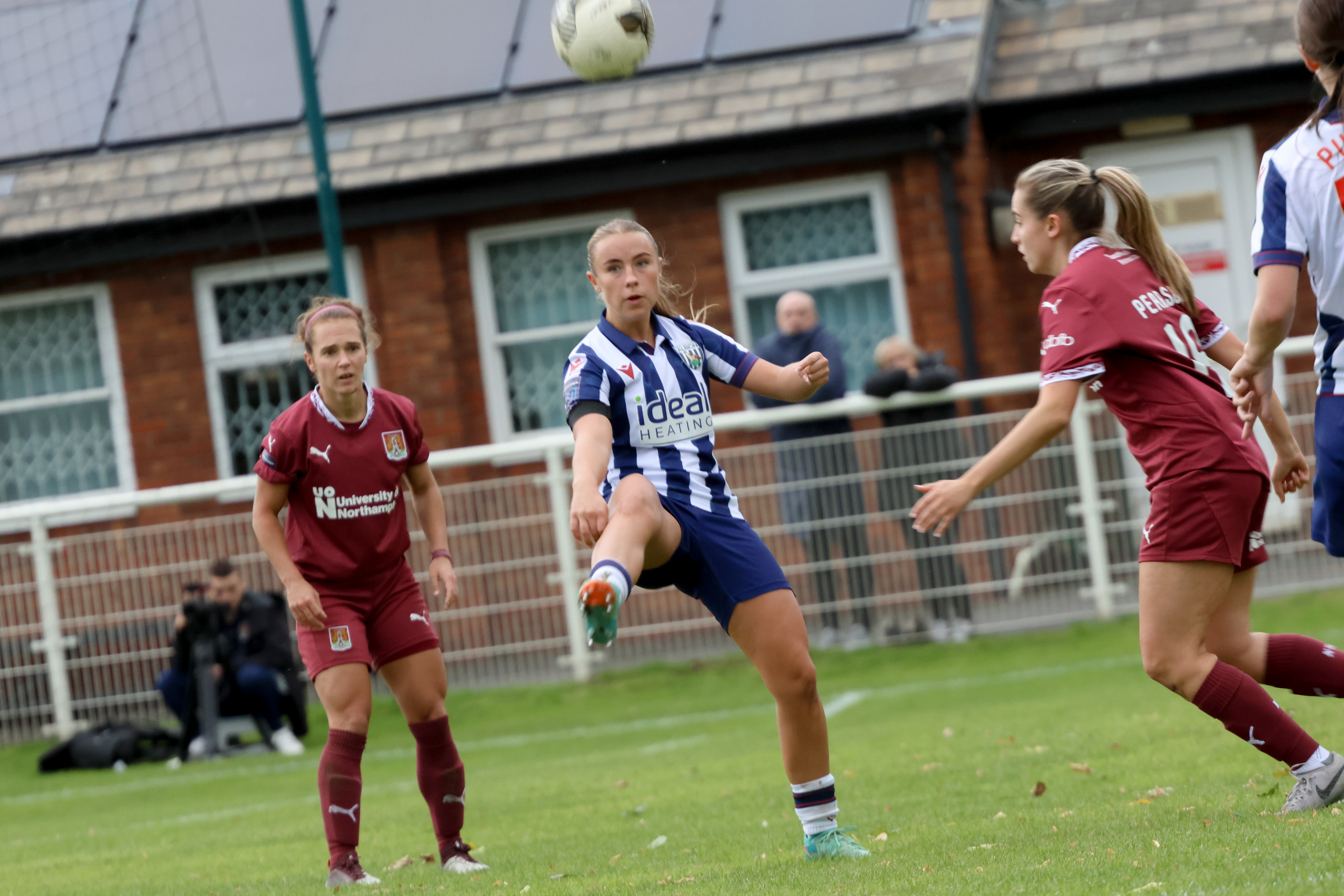 Seren Watkins in action against Northampton Town in the FAWNL Cup in the home kit 