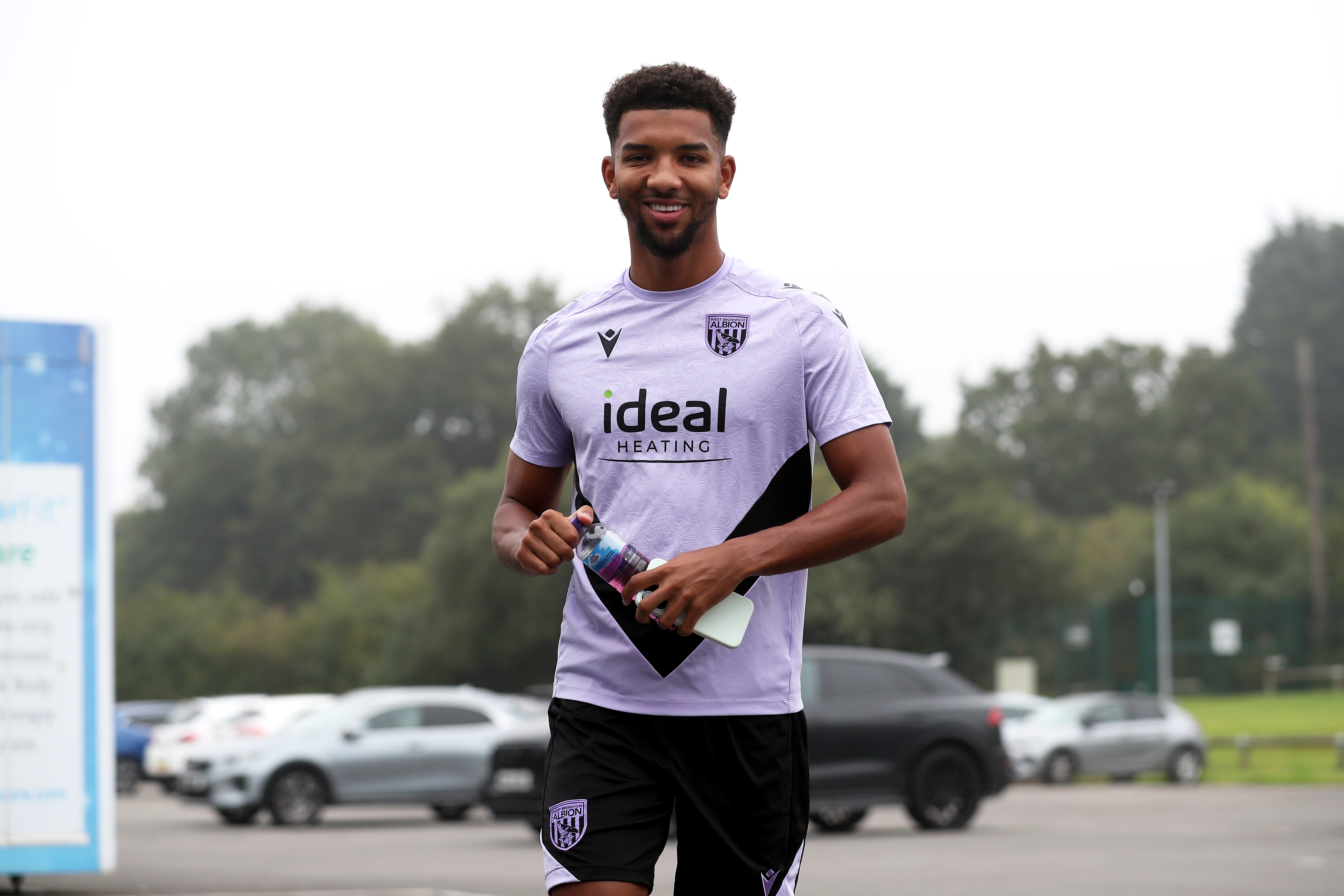 Mason Holgate walking to the entrance of the training ground through the car park